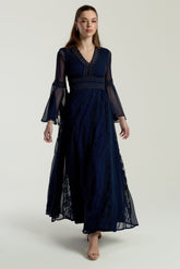 Frock & Frill Aiden navy chiffon maxi dress with sheer long sleeves, lace detailing, and a flowing elegant silhouette—perfect for weddings, evening events, and formal occasions.