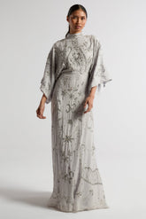 Aramina Silver Embellished Maxi Dress with long sleeves, floor-length silhouette, beaded and sequined detailing, modest evening gown for weddings and formal events.