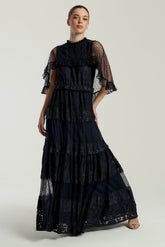 Edith Navy Lace Maxi Dress with Cape Detail by Frock and Frill, floor-length navy dress with lace overlay and flowing cape sleeves, ideal for weddings and parties