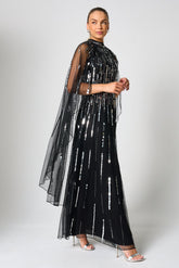 Eileen black sequin cape sleeve maxi dress with full-length silhouette and all-over sparkle designed for elegant evening and occasion wear styling