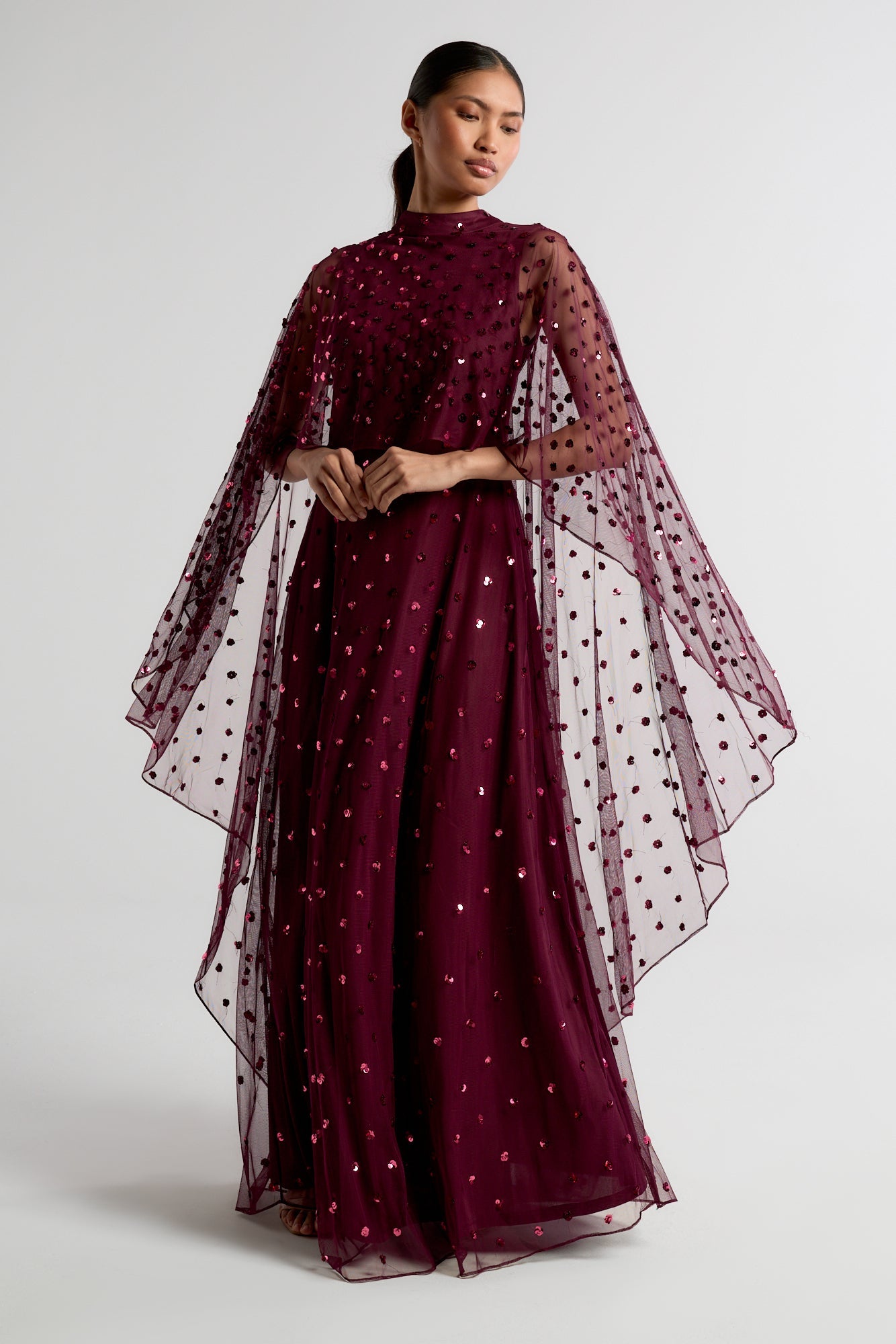 Elysia Purple Cape Dress with flowing floor-length silhouette, subtle sequin embellishments, and elegant cape overlay for weddings and evening occasions