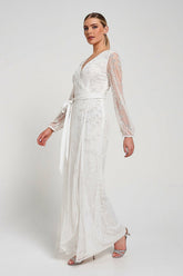 Grace white embellished maxi dress with tonal leaf detailing, faux wrap silhouette and long sleeves designed for elegant bridal and occasion wear styling