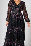 Iris black iridescent sequin maxi dress with V neckline, sheer sleeves and tiered skirt designed for elegant evening and occasion wear styling