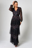 Iris black iridescent sequin maxi dress with V neckline, sheer sleeves and tiered skirt designed for elegant evening and occasion wear styling