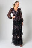 Iris black iridescent sequin maxi dress with V neckline, sheer sleeves and tiered skirt designed for elegant evening and occasion wear styling
