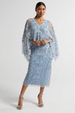 Juliana Blue Embellished Midi Dress With Cape Detail by Frock and Frill in cornflower blue with all-over beading and flowing cape overlay.