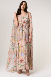 Melia floral print cape sleeve maxi dress by Frock and Frill with vibrant floral pattern and flowing silhouette designed for elegant occasion wear styling