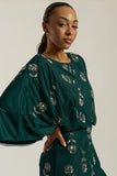 Naida rainforest green embellished maxi dress by Frock and Frill with batwing sleeves and silver floral beadwork designed for flowing statement occasion wear styling