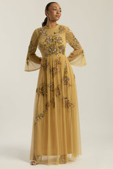Saffron yellow gold embellished maxi dress with floral beading, sheer three-quarter sleeves and flowing skirt by Frock and Frill.