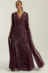 Simone fig sequin cape sleeve maxi dress with plunging V neckline, silver criss-cross sequin detailing and flowing full-length silhouette for statement occasion wear styling