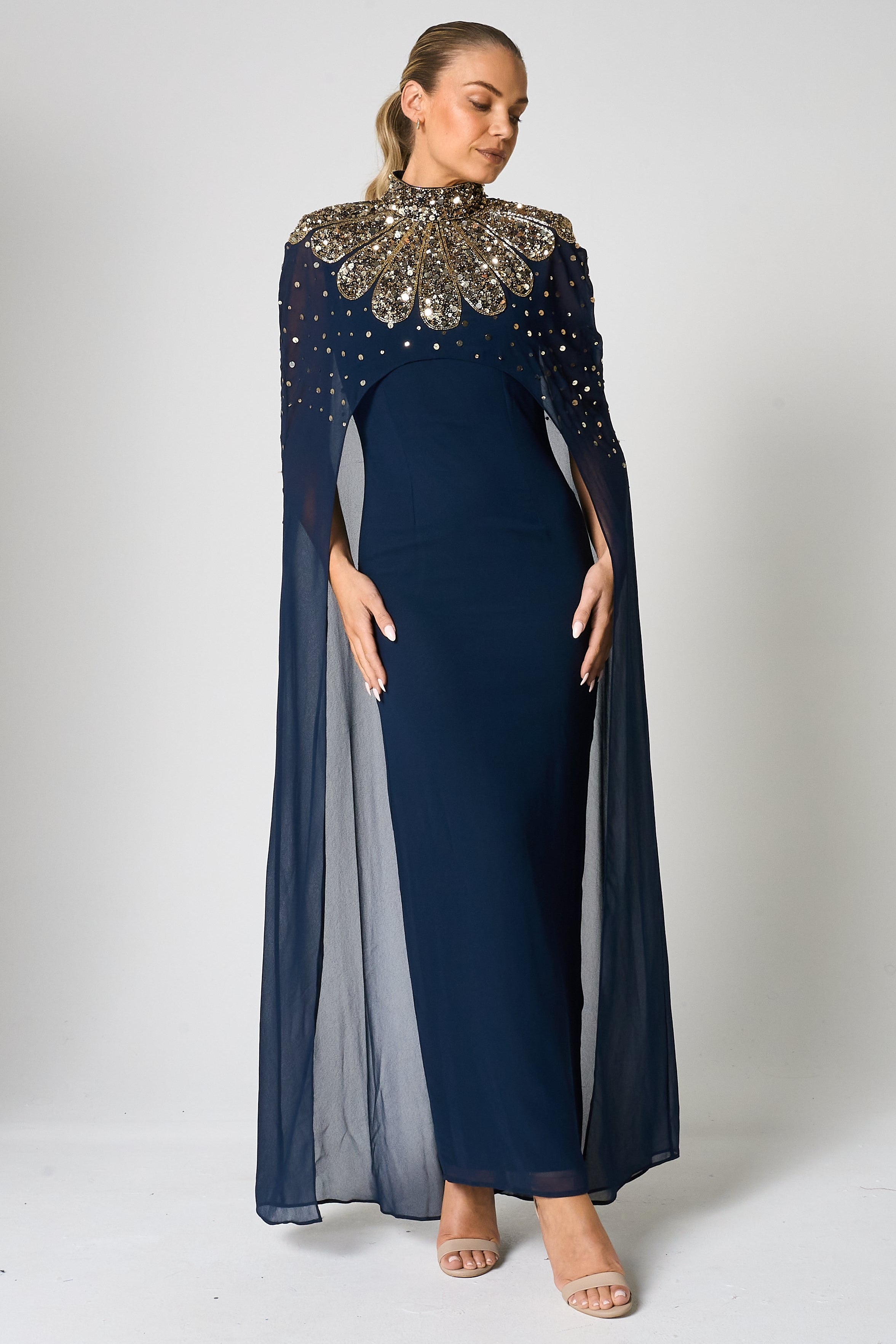 Zadie Navy Embellished Cape Maxi Dress with gold embellished neckline and flowing sheer cape