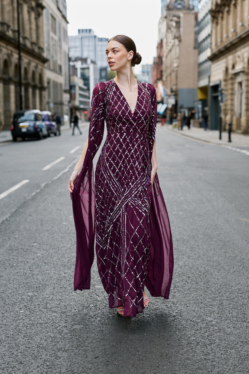 Simone fig sequin cape sleeve maxi dress with plunging V neckline, silver criss-cross sequin detailing and flowing full-length silhouette for statement occasion wear styling