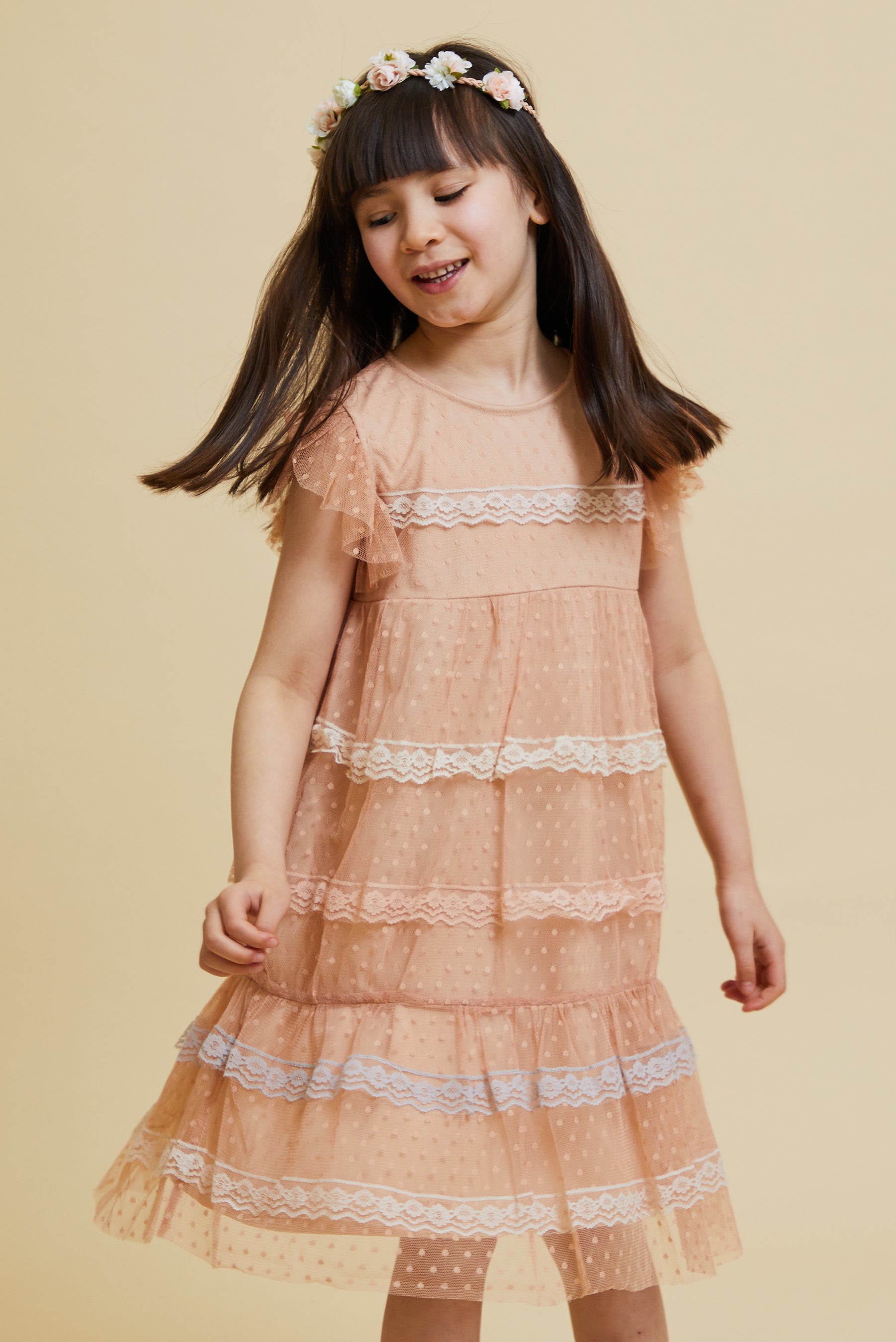 Corabelle pink ruffled lace dress with pastel lace trim and polka dot mesh overlay designed for children’s occasion wear and special events styling
