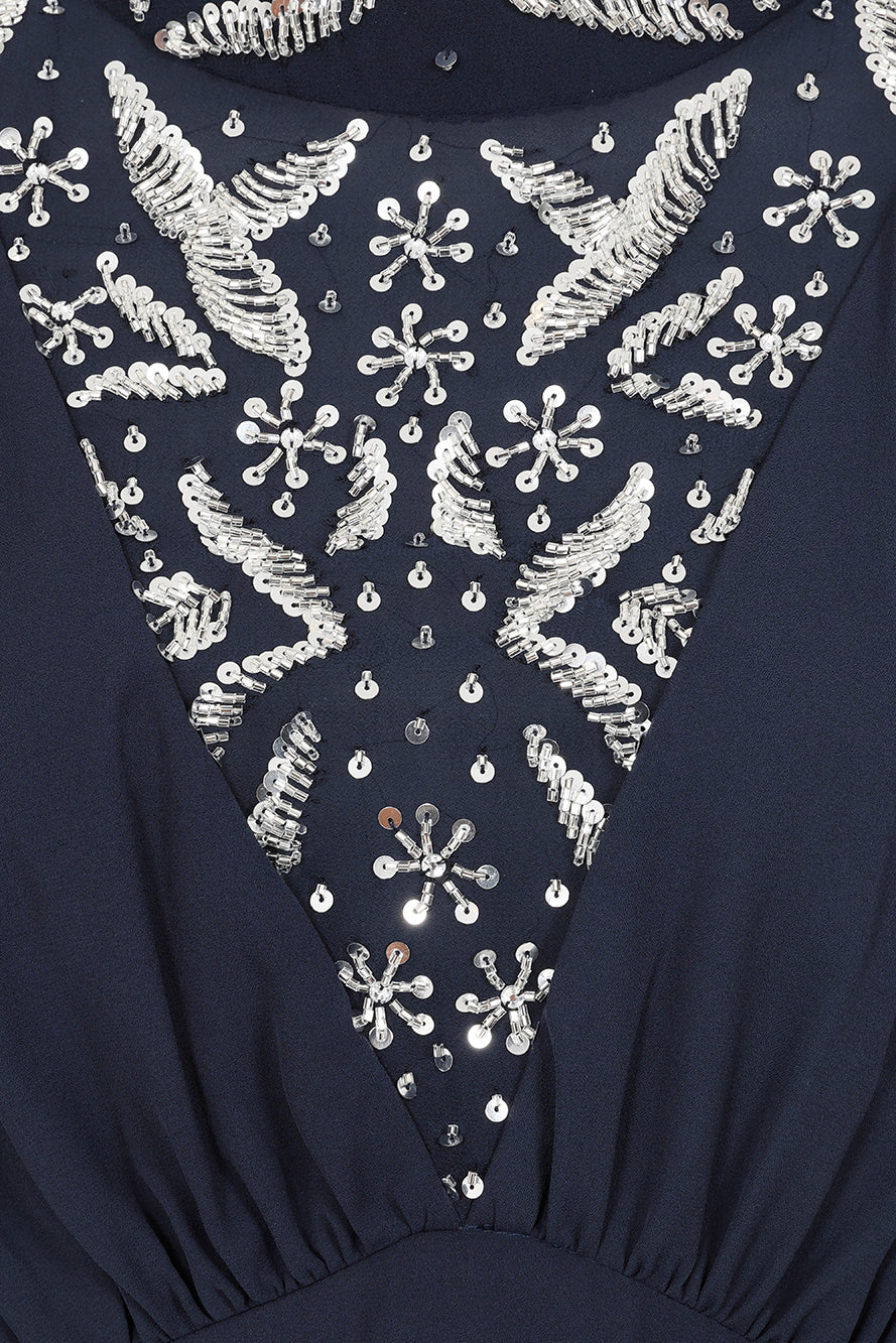 Alani navy embellished cape sleeve midi dress by Frock and Frill with high neckline, silver embellishment and flowing cape sleeves designed for elegant occasion wear styling