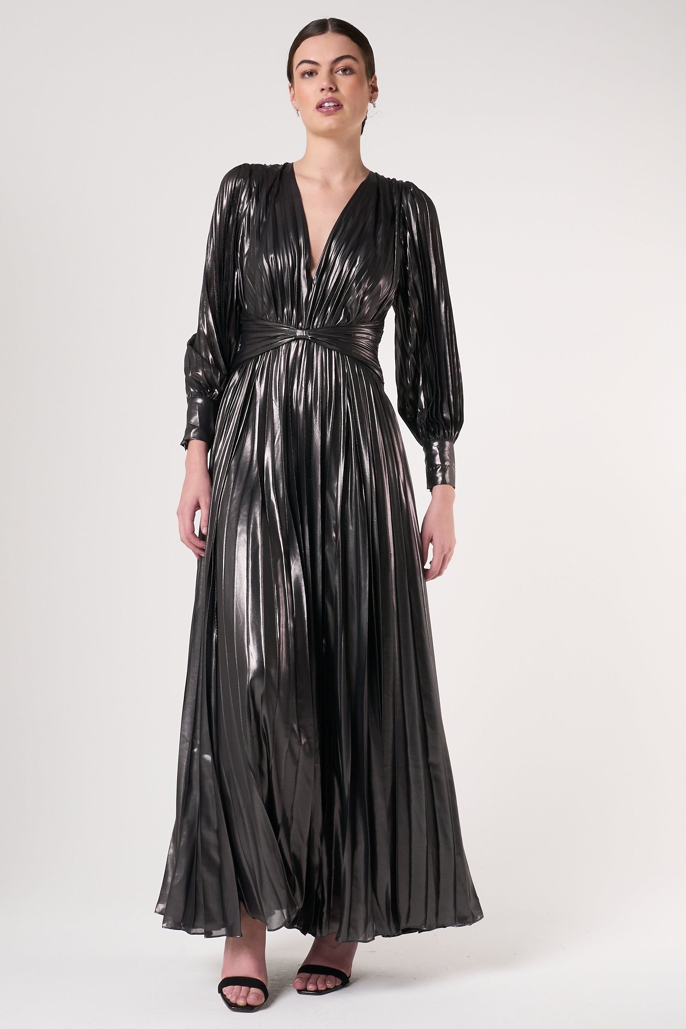 Alberta metallic charcoal pleated maxi dress with V neckline, blouson sleeves and waist twist detail designed for elegant evening and occasion wear styling