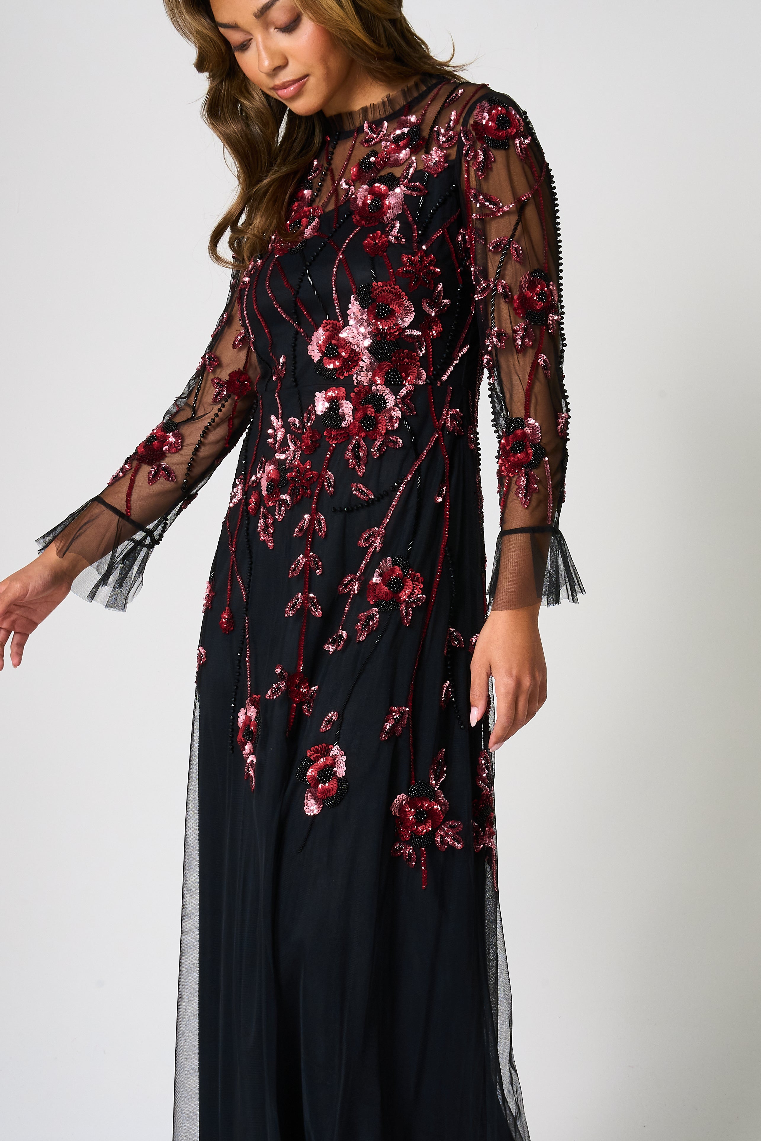 Aliza black floral embellished maxi dress by Frock and Frill with pink and red floral detailing, sheer mesh overlay and ruffle accents for elegant occasion wear styling