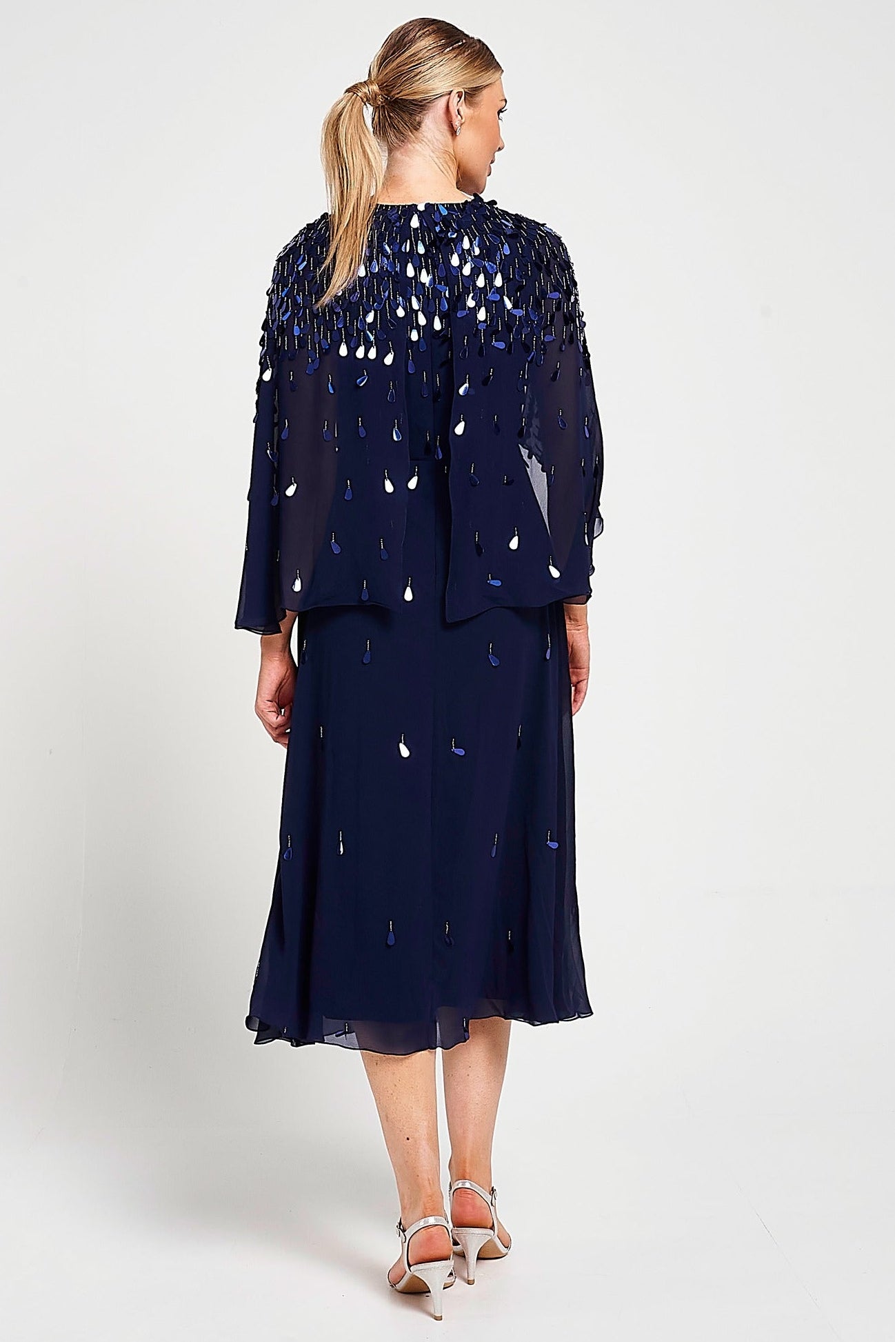 Annette navy embellished cape sleeve midi dress with tonal sequin detailing and flowing silhouette designed for elegant wedding guest and occasion wear styling