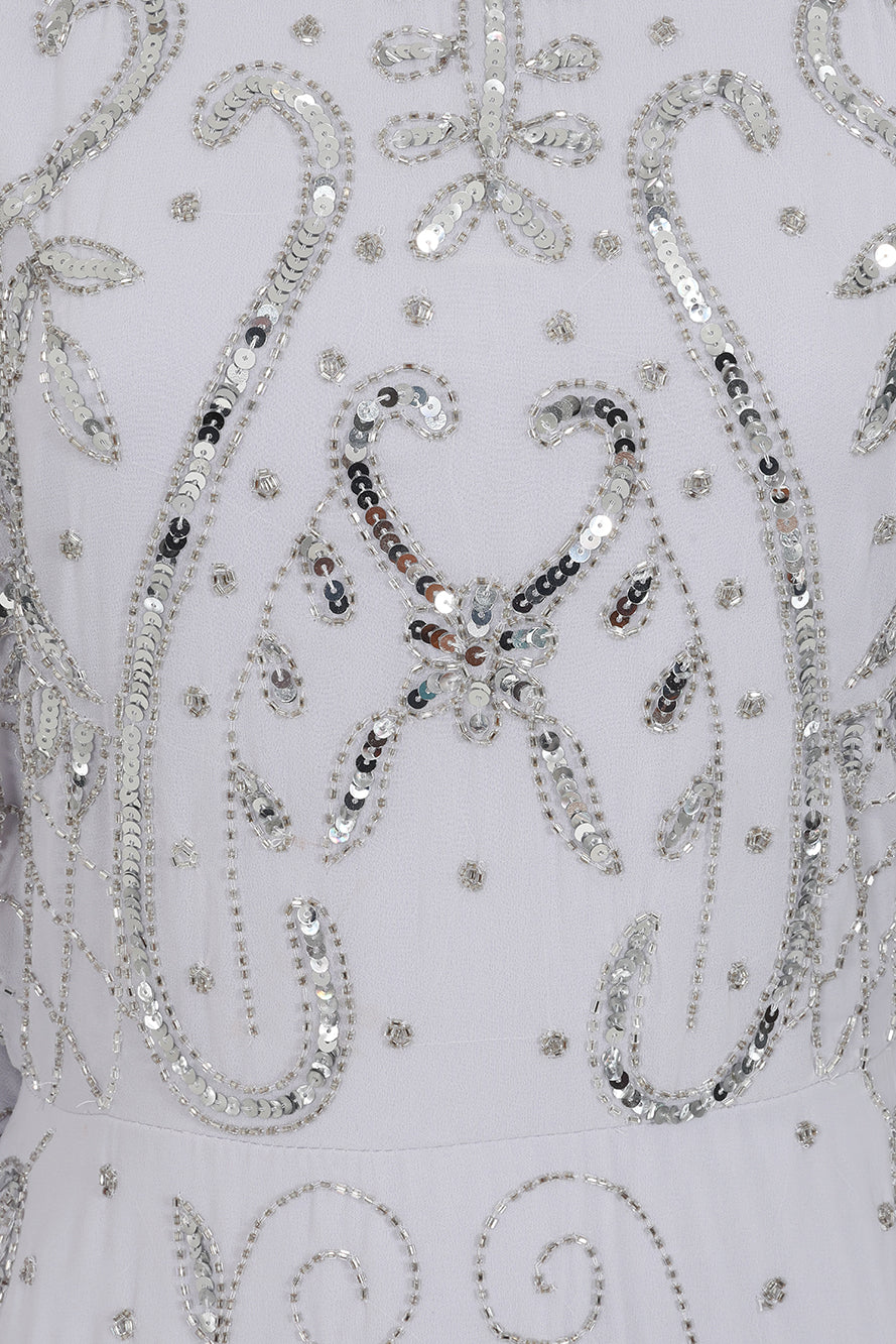 Aramina Silver Embellished Maxi Dress with long sleeves, floor-length silhouette, beaded and sequined detailing, modest evening gown for weddings and formal events.