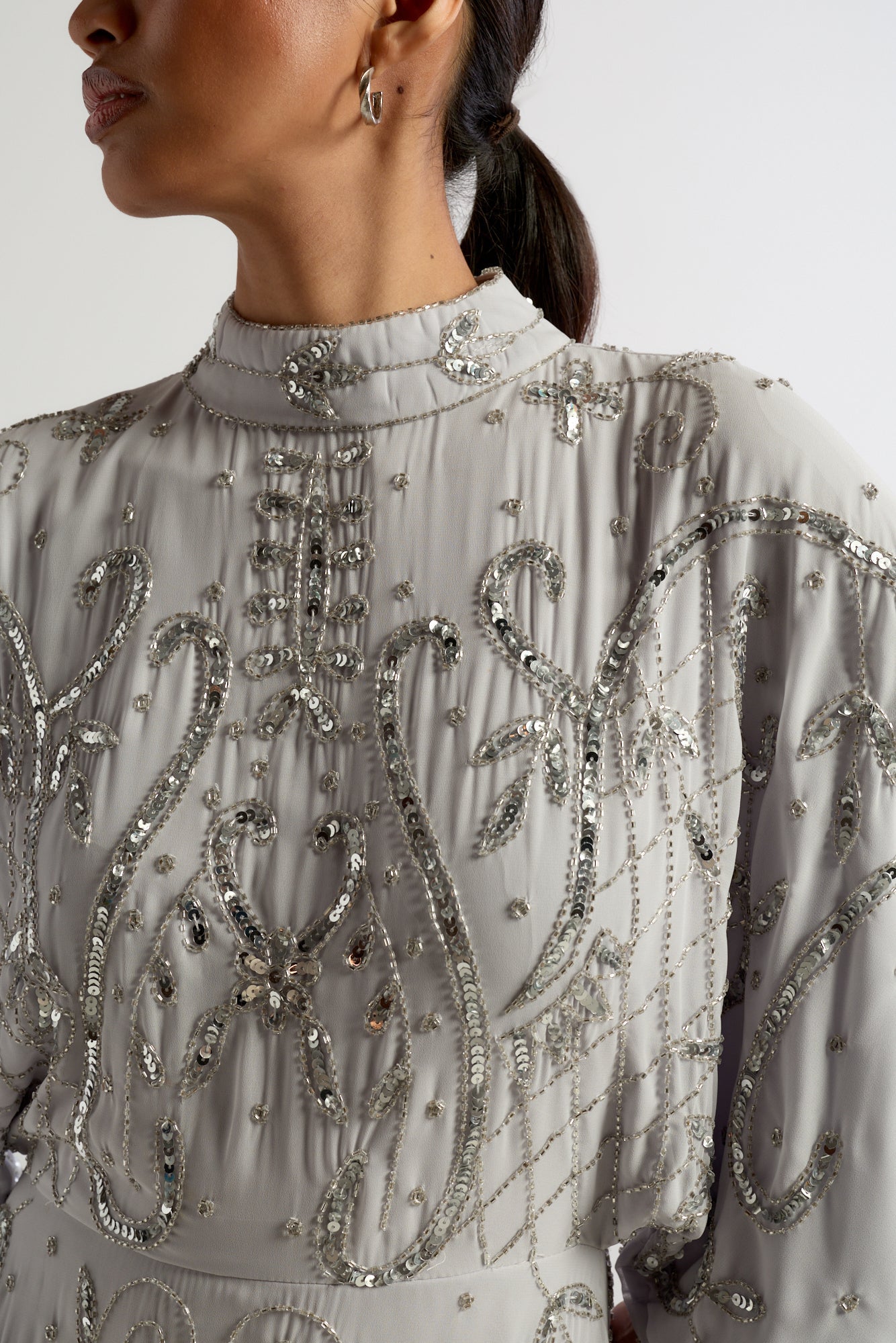 Aramina Silver Embellished Maxi Dress with long sleeves, floor-length silhouette, beaded and sequined detailing, modest evening gown for weddings and formal events.