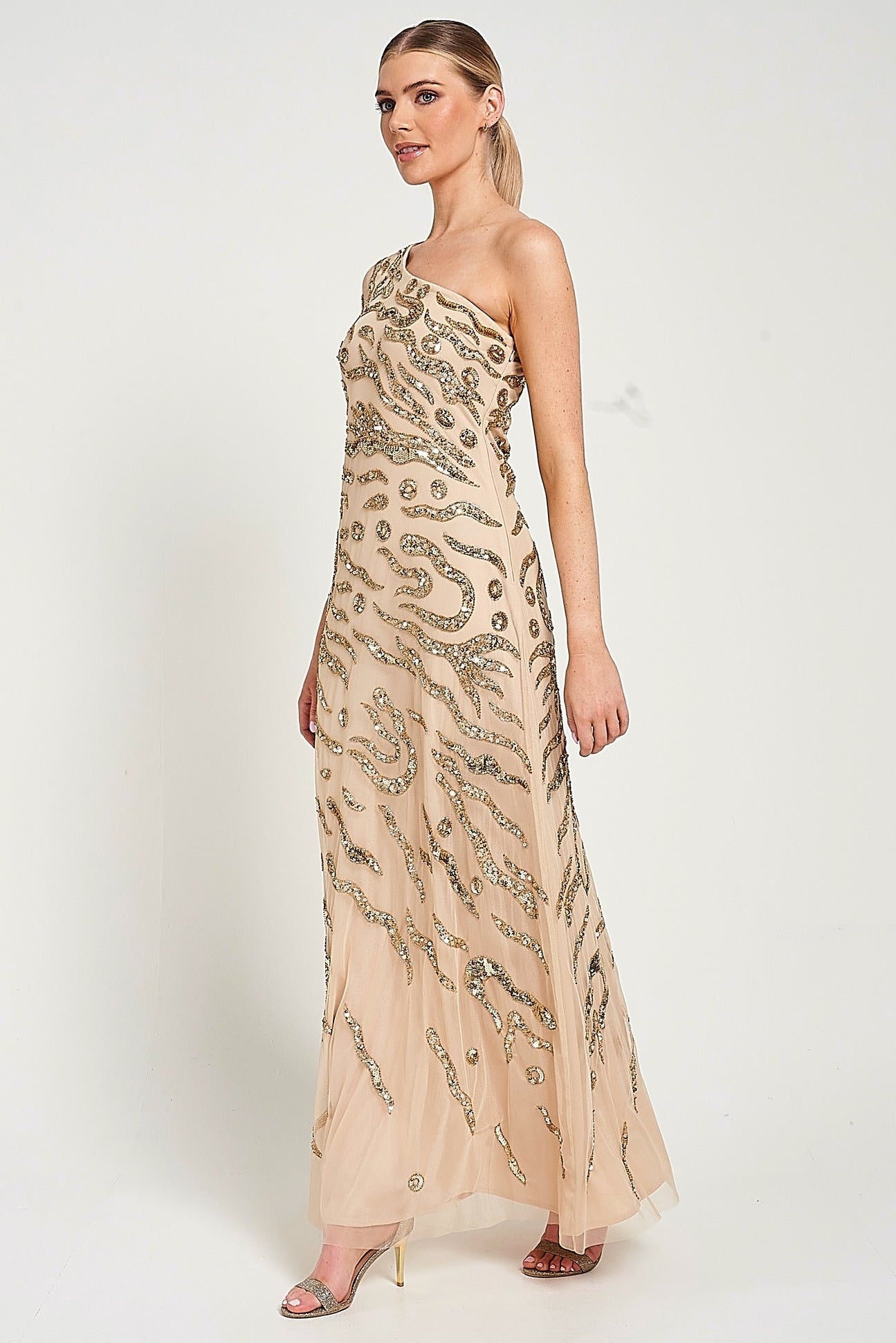 Arlene one shoulder cape sleeve embellished maxi dress in nude gold with sequin detailing designed for elegant evening and occasion wear styling