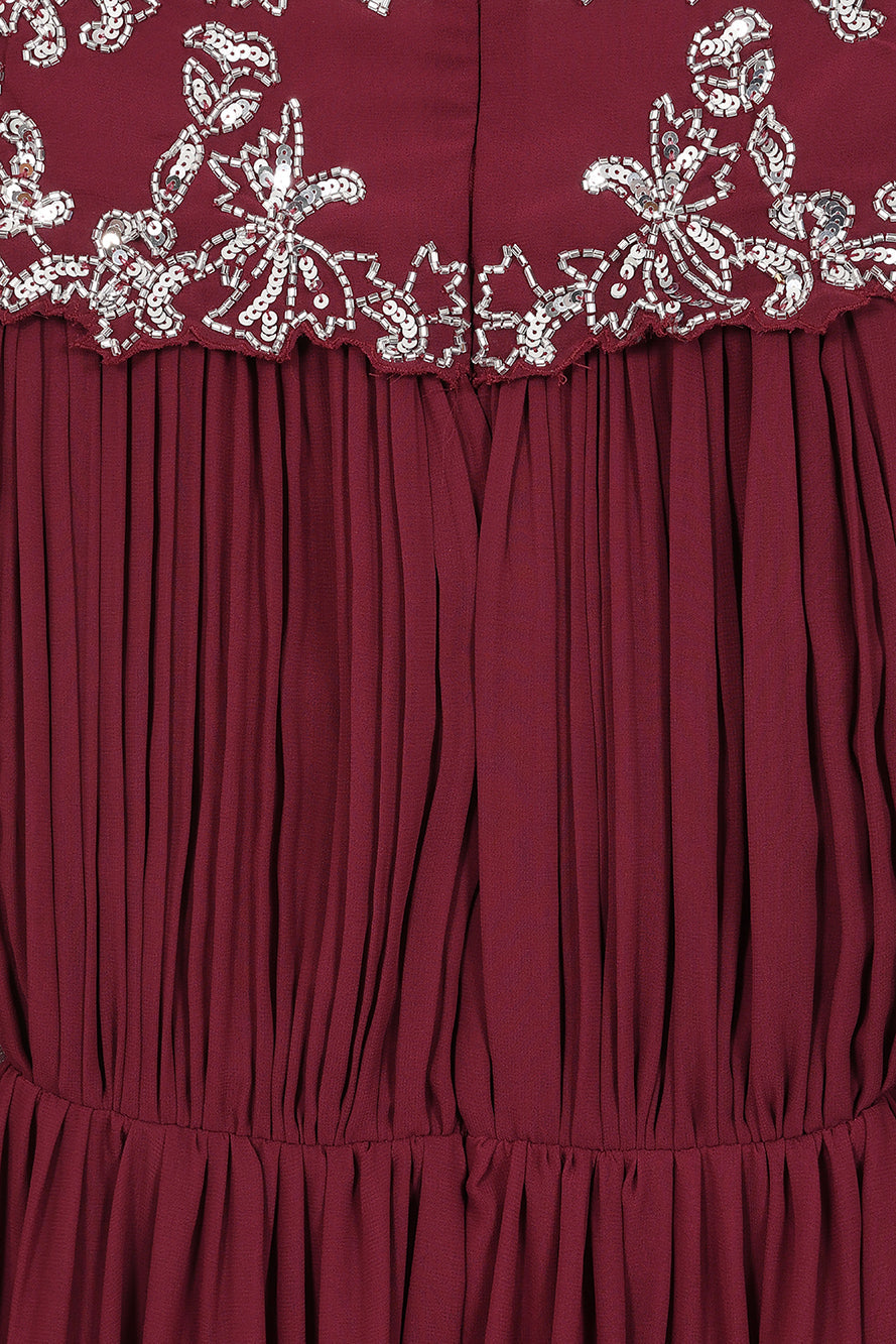 Frock & Frill Aruna burgundy embellished cape maxi dress with sparkling beaded bodice, flowing chiffon cape sleeves, and elegant full-length silhouette—ideal for weddings and formal events.