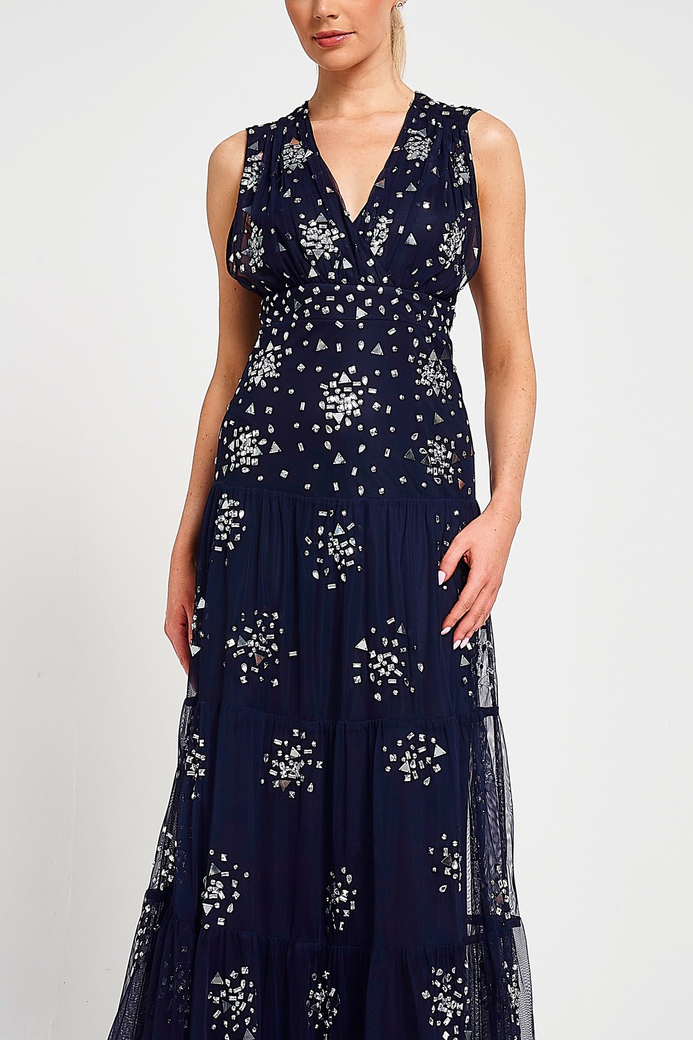 Aveline navy embellished sleeveless maxi dress with v-neck bodice, silver beadwork and tiered skirt, full-length formal occasion dress