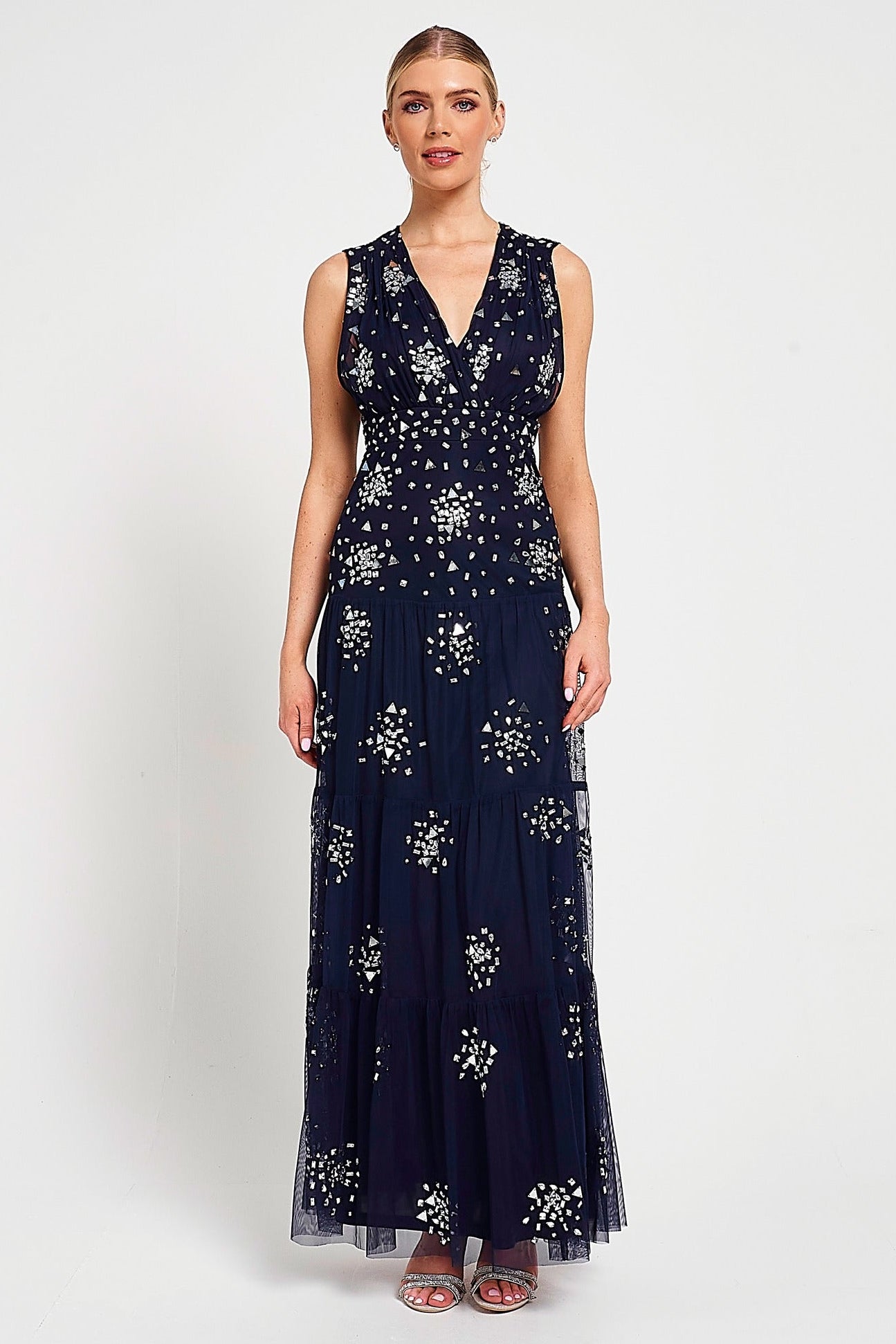 Aveline navy embellished sleeveless maxi dress with v-neck bodice, silver beadwork and tiered skirt, full-length formal occasion dress