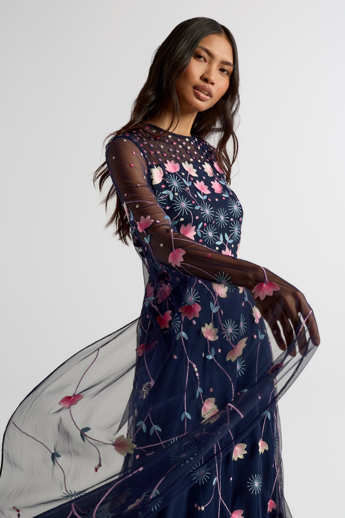 Azalea Navy Floral Cape Sleeve Maxi Dress by Frock and Frill with embroidered floral detail, flowing cape sleeves and modest evening design.