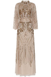 Celestine neutral-hued gold embellished maxi dress with flowing cape overlay, long sleeves, and modest elegant silhouette for weddings and formal occasions.