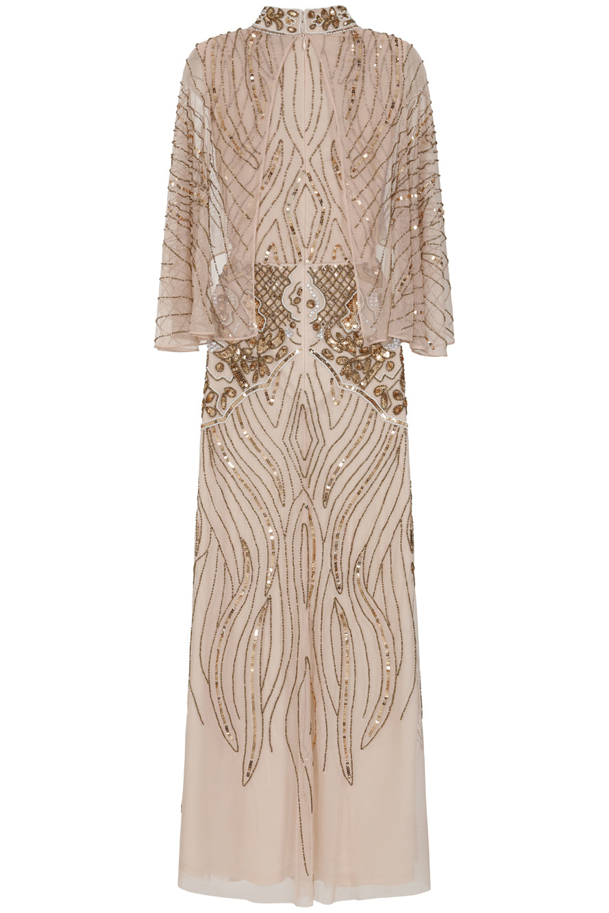 Celestine neutral-hued gold embellished maxi dress with flowing cape overlay, long sleeves, and modest elegant silhouette for weddings and formal occasions.