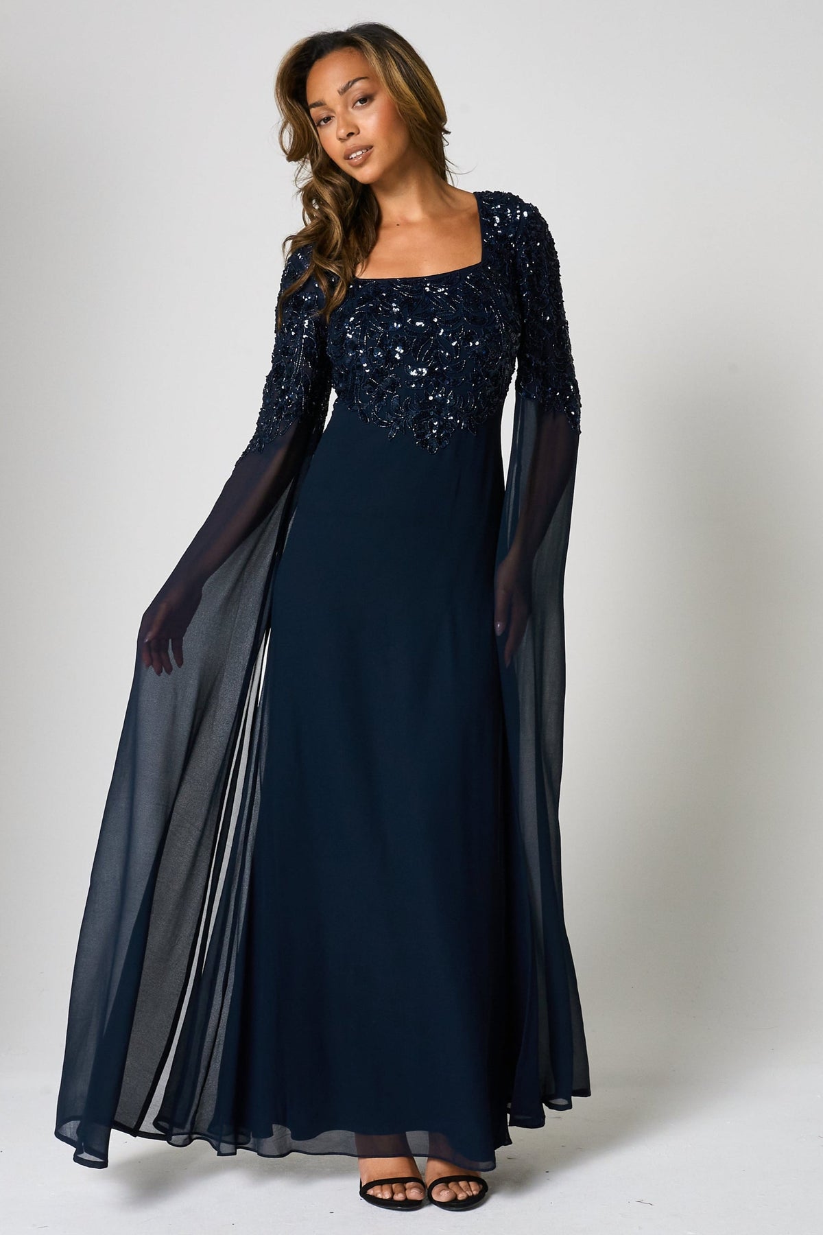 Cherith navy embellished cape sleeve maxi dress by Frock and Frill with square neckline, cascading bodice embellishment and full-length silhouette for elegant occasion wear styling