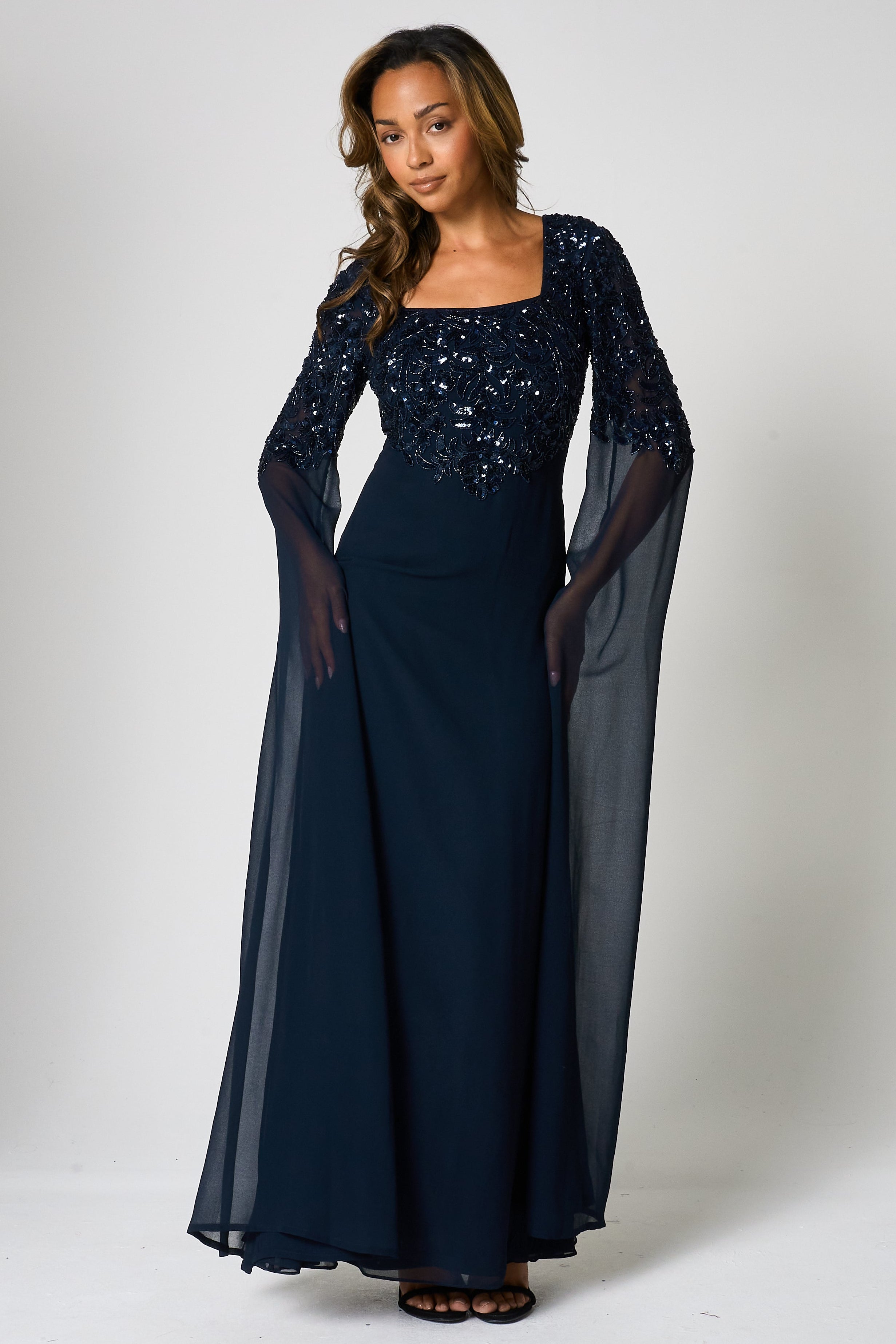 Cherith navy embellished cape sleeve maxi dress by Frock and Frill with square neckline, cascading bodice embellishment and full-length silhouette for elegant occasion wear styling