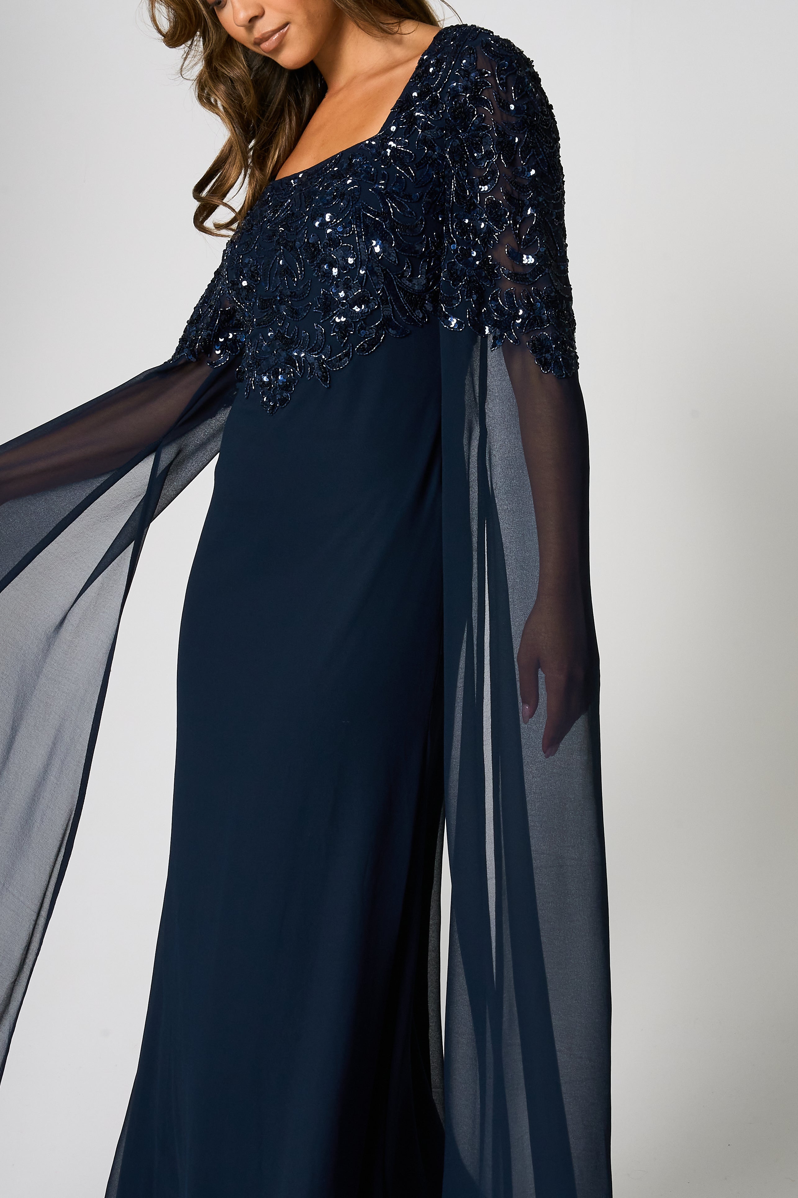 Cherith navy embellished cape sleeve maxi dress by Frock and Frill with square neckline, cascading bodice embellishment and full-length silhouette for elegant occasion wear styling