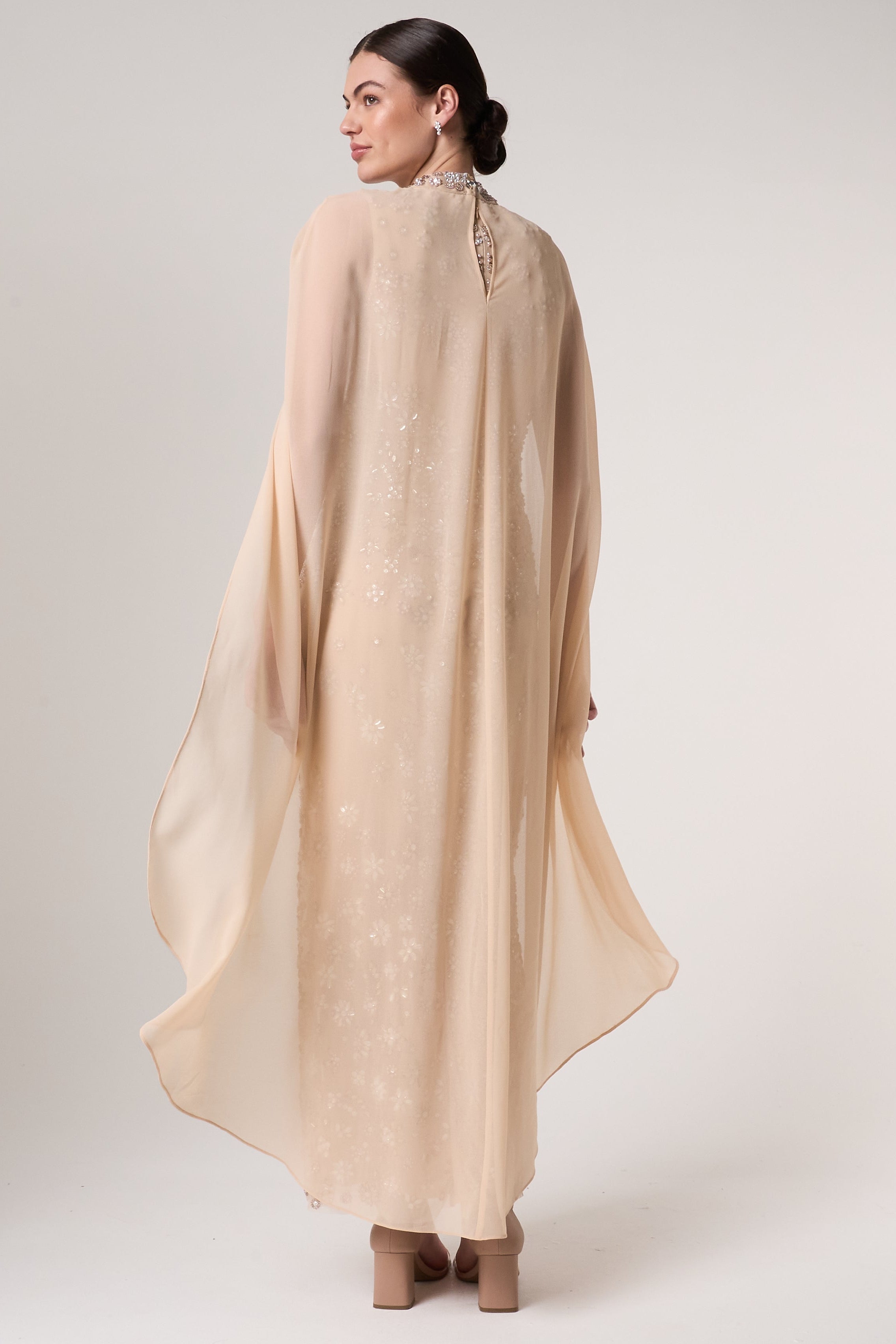 Clementine floral embellished cape sleeve maxi dress with tonal floral beadwork, sheer cape sleeves and flowing silhouette for elegant occasion wear styling