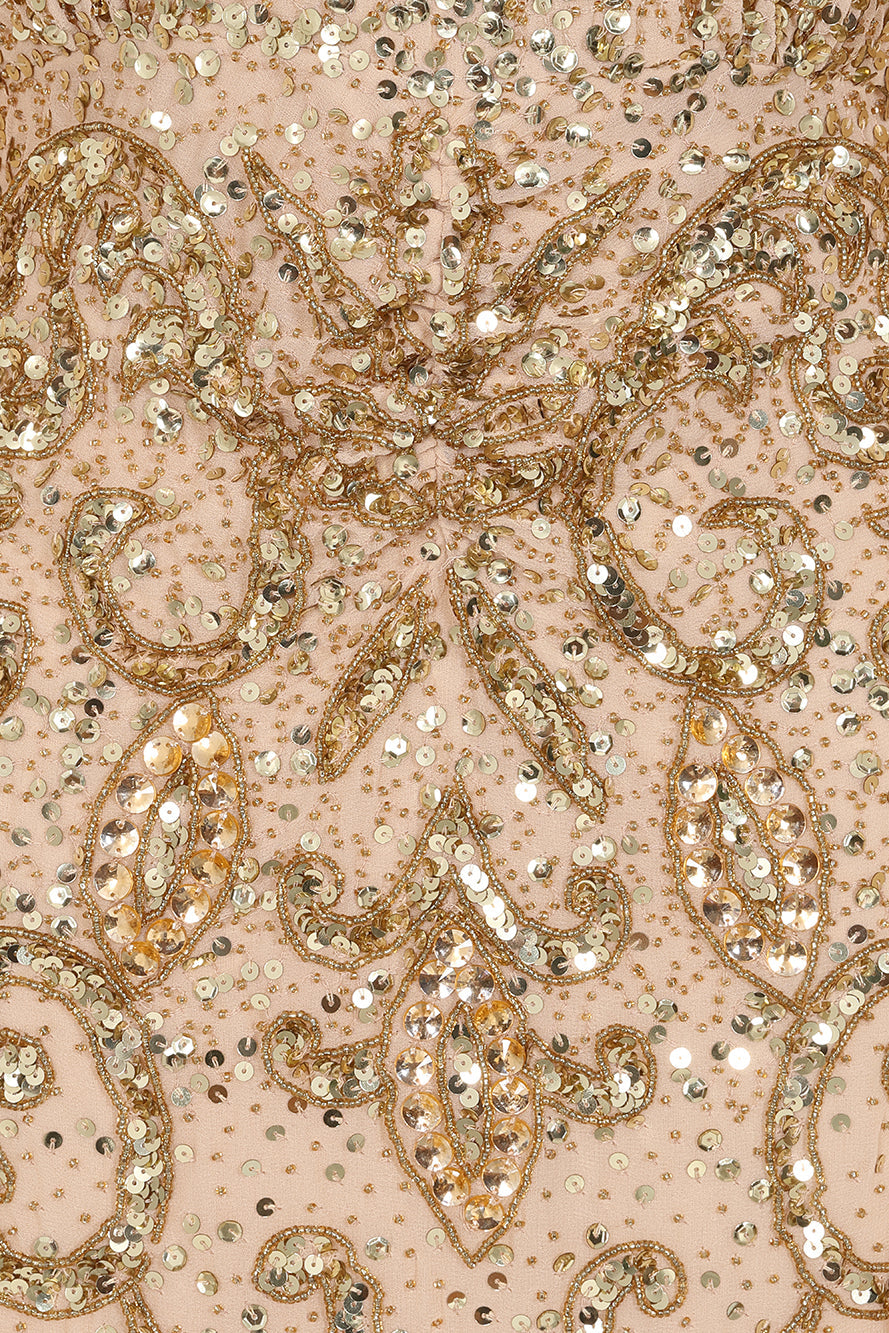 Donna gold embellished maxi dress with flowing cape sleeves, intricate beaded bodice and scattered sequins cascading to the hem.