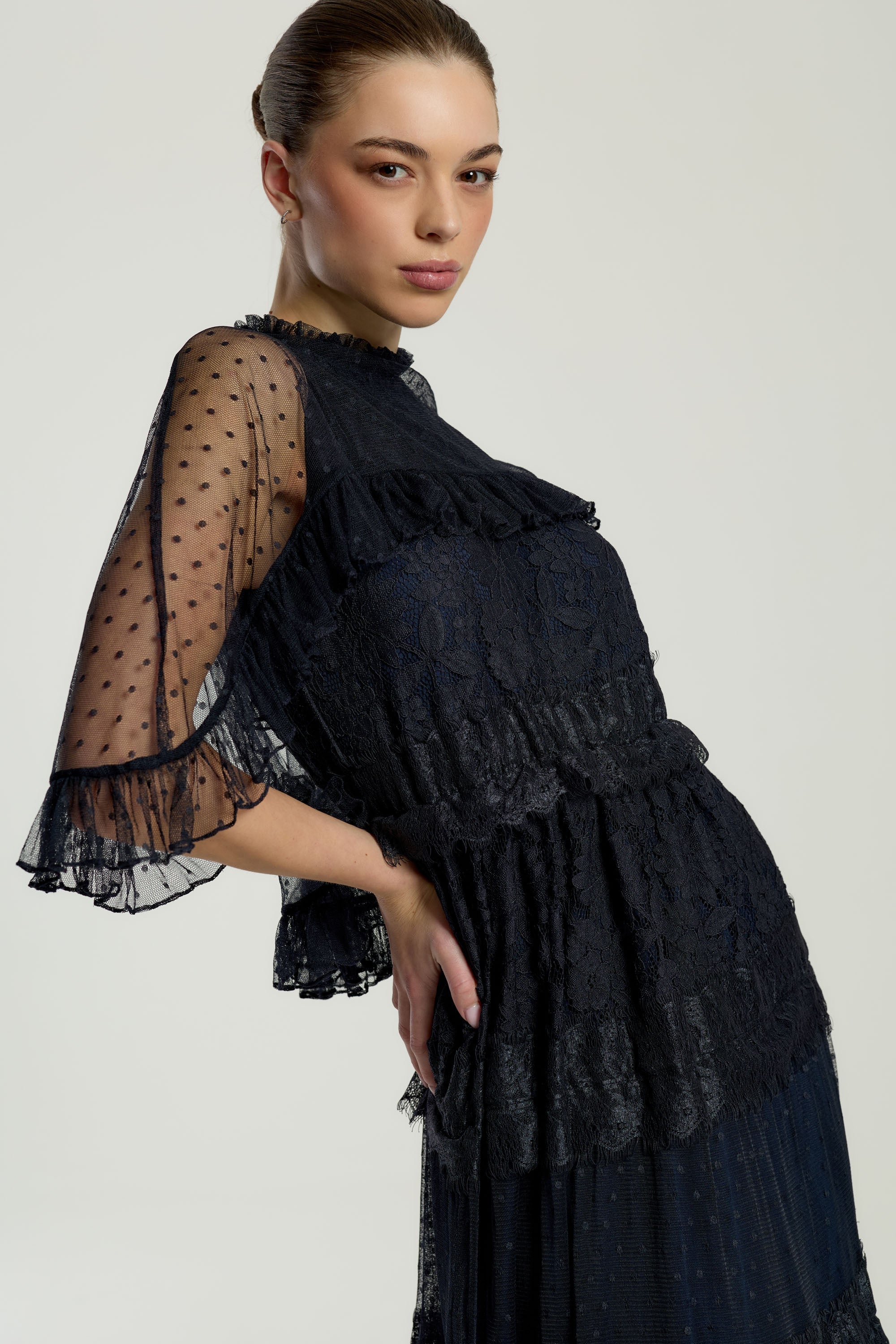 Edith Navy Lace Maxi Dress with Cape Detail by Frock and Frill, floor-length navy dress with lace overlay and flowing cape sleeves, ideal for weddings and parties