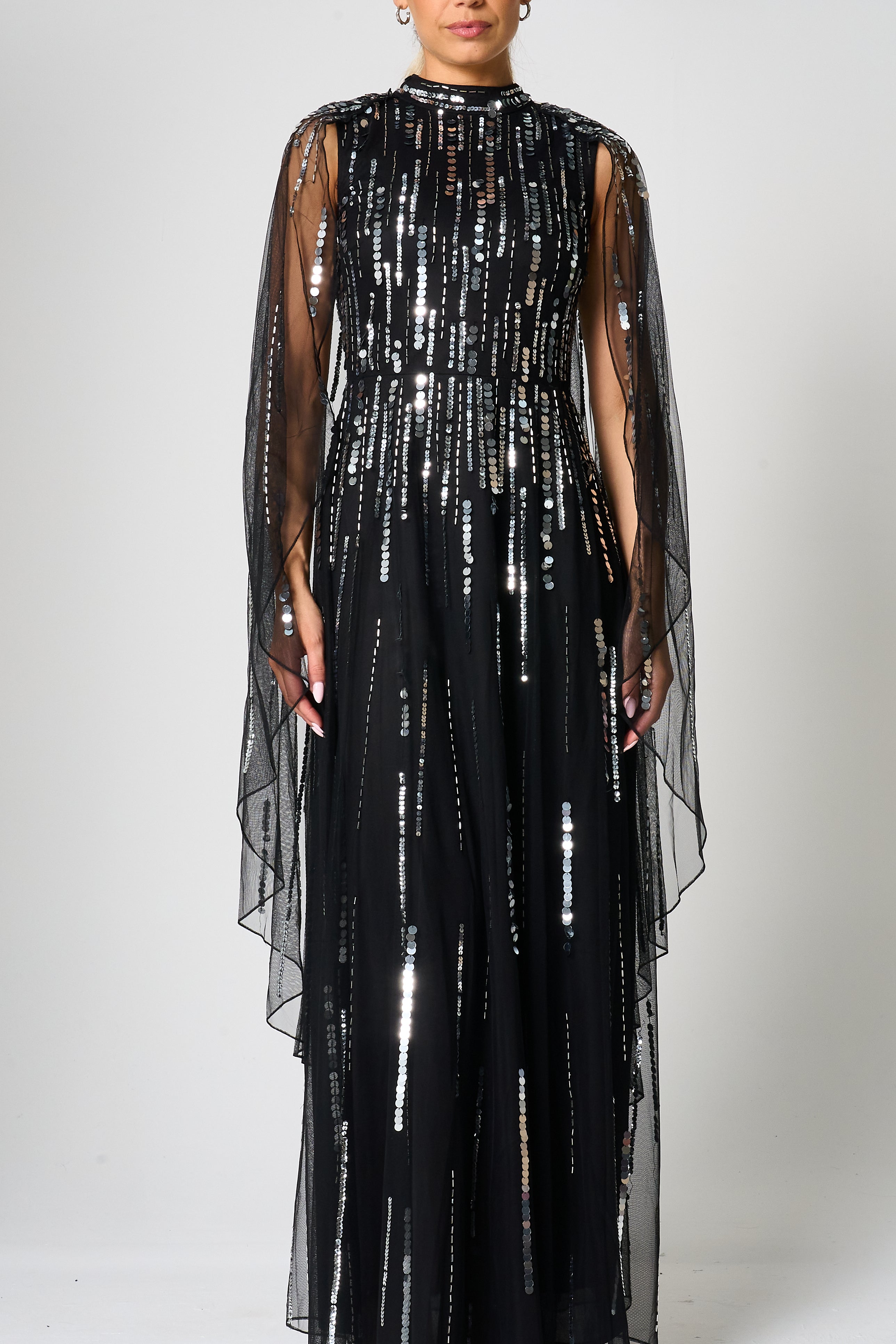 Eileen black sequin cape sleeve maxi dress with full-length silhouette and all-over sparkle designed for elegant evening and occasion wear styling