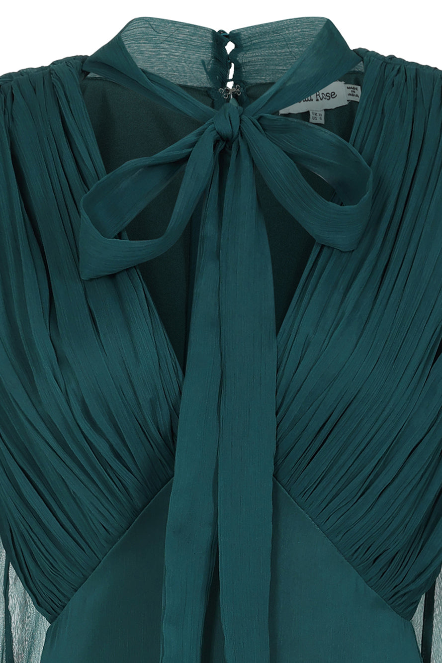Elaine storm green tie neck maxi dress with long sleeves and floor-length silhouette designed for elegant wedding guest and occasion wear styling