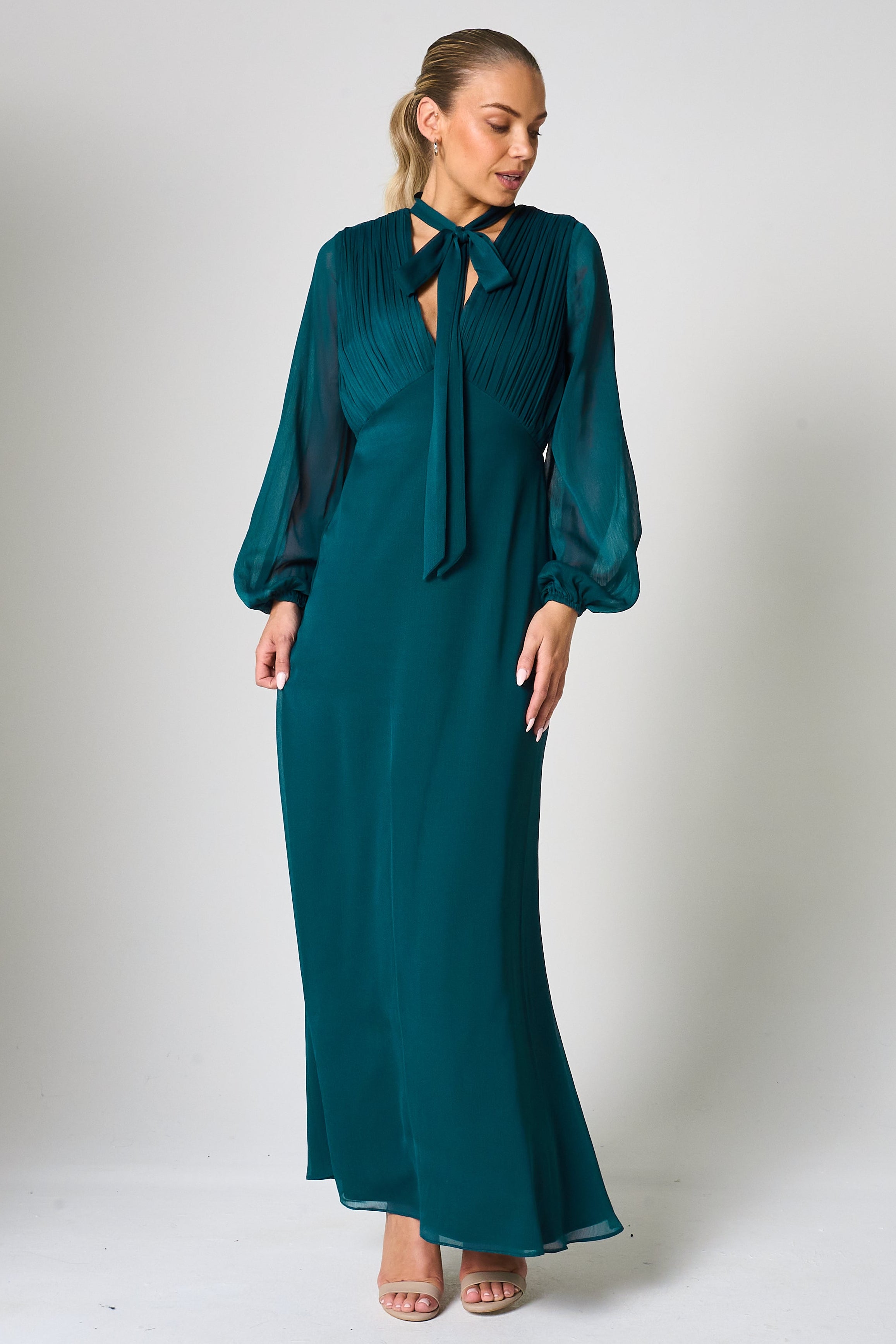 Elaine storm green tie neck maxi dress with long sleeves and floor-length silhouette designed for elegant wedding guest and occasion wear styling