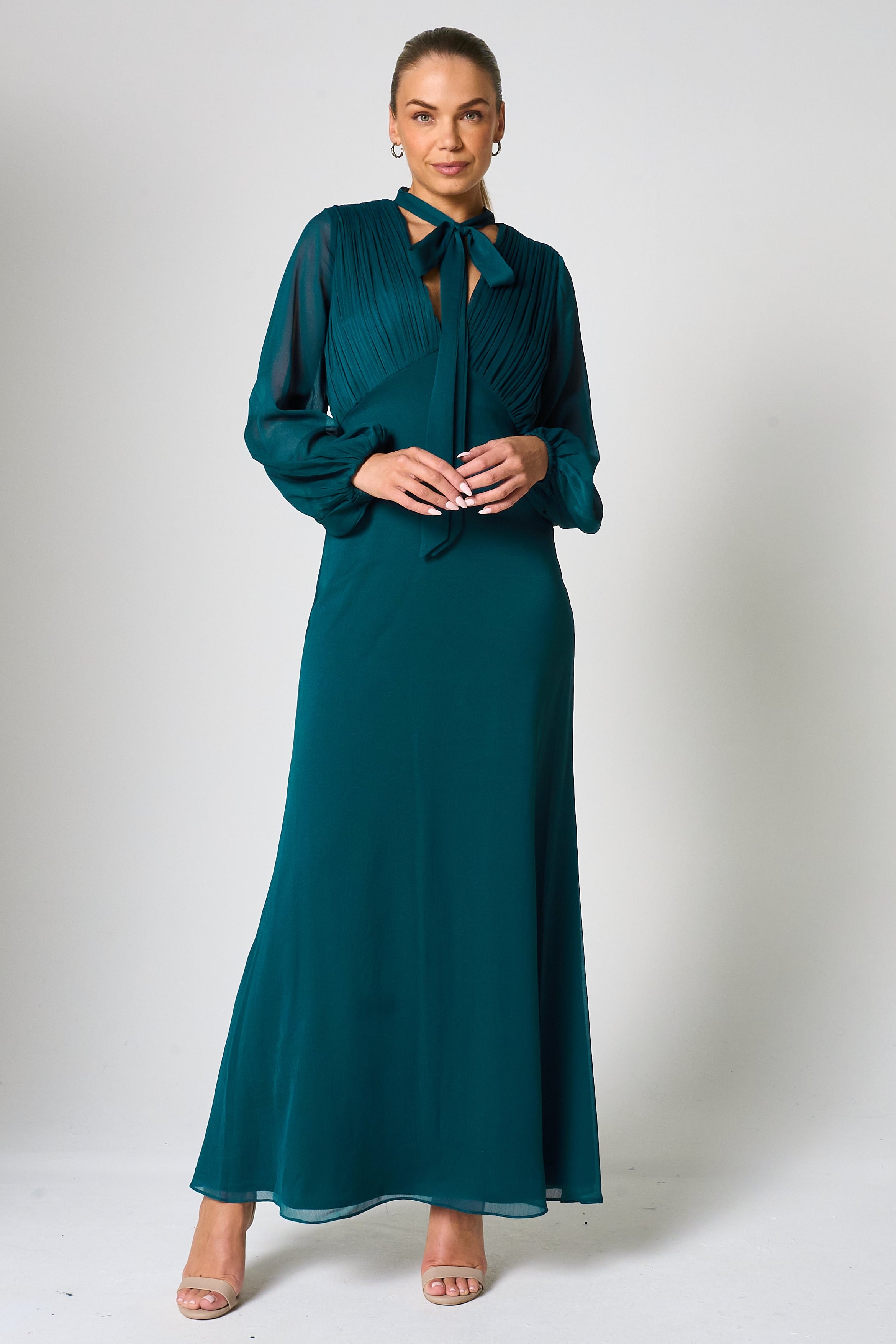 Elaine storm green tie neck maxi dress with long sleeves and floor-length silhouette designed for elegant wedding guest and occasion wear styling