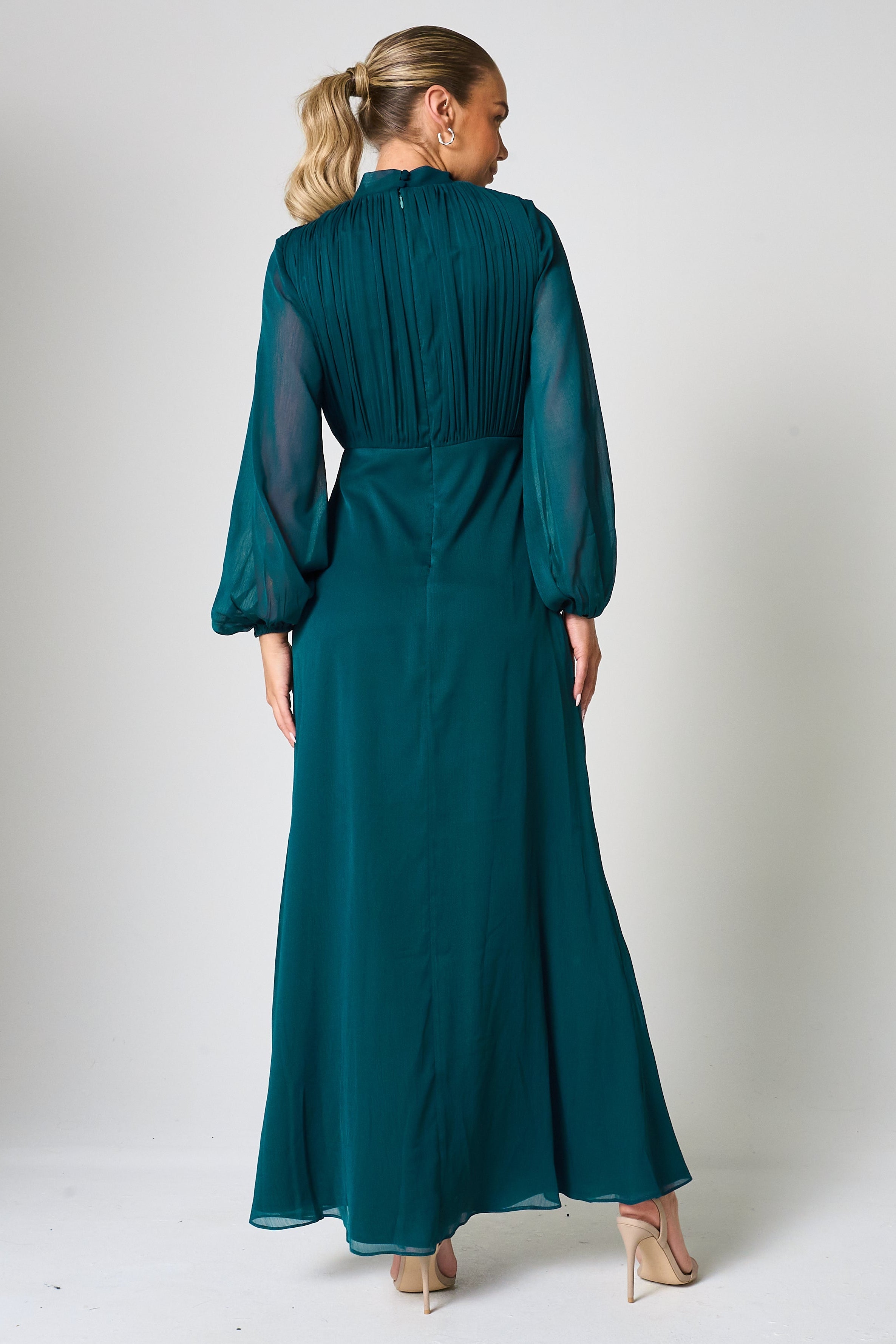 Elaine storm green tie neck maxi dress with long sleeves and floor-length silhouette designed for elegant wedding guest and occasion wear styling
