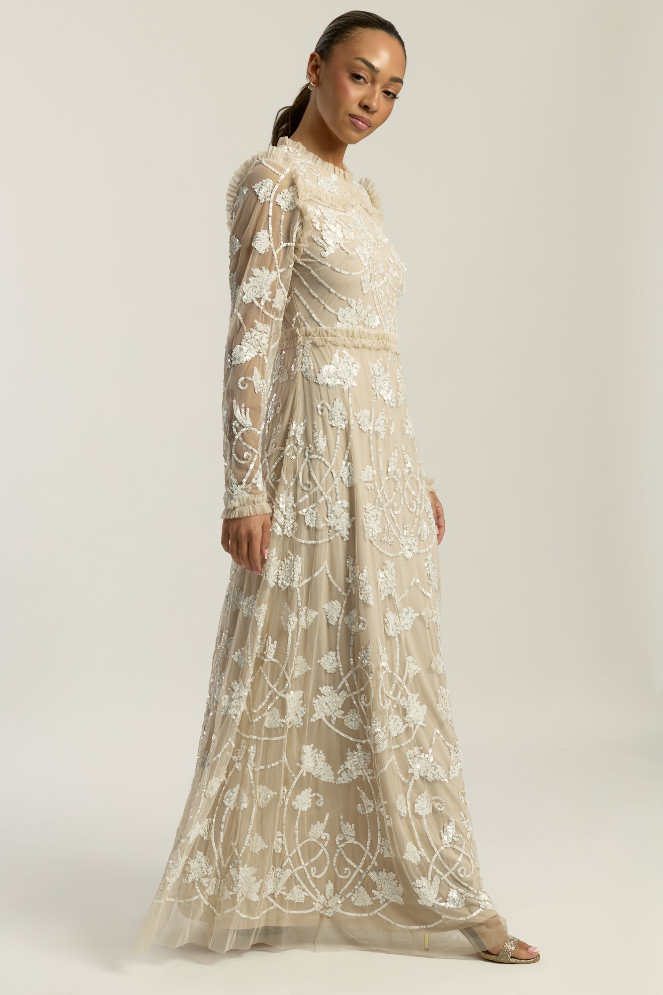 Elowen long sleeve embellished maxi dress by Frock and Frill UK in neutral tones with intricate white beadwork, modest style for weddings and formal occasions.