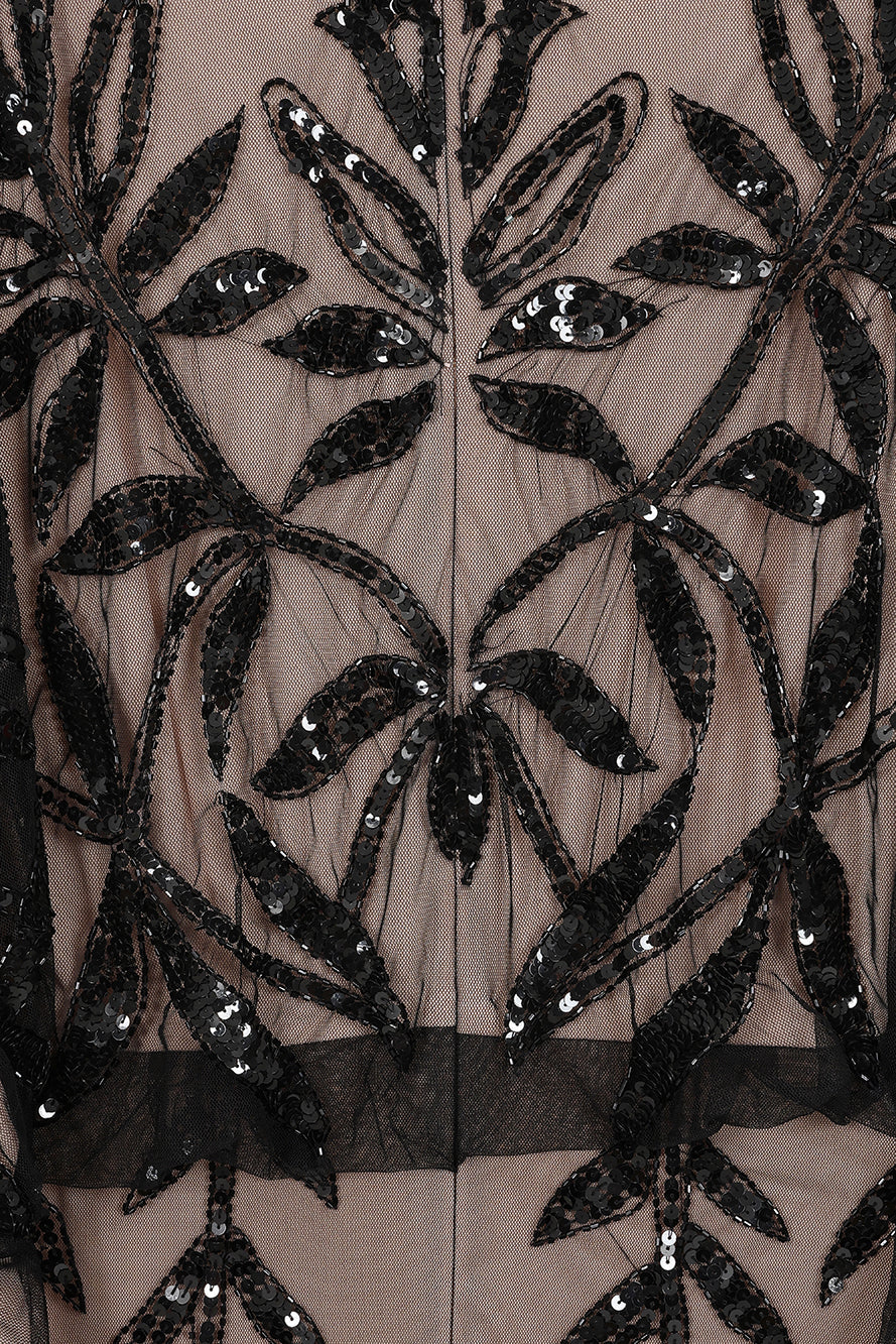 Elva sequin maxi dress with black leaf motif embellishment on a neutral base, batwing sleeves and flowing silhouette for statement occasion wear styling