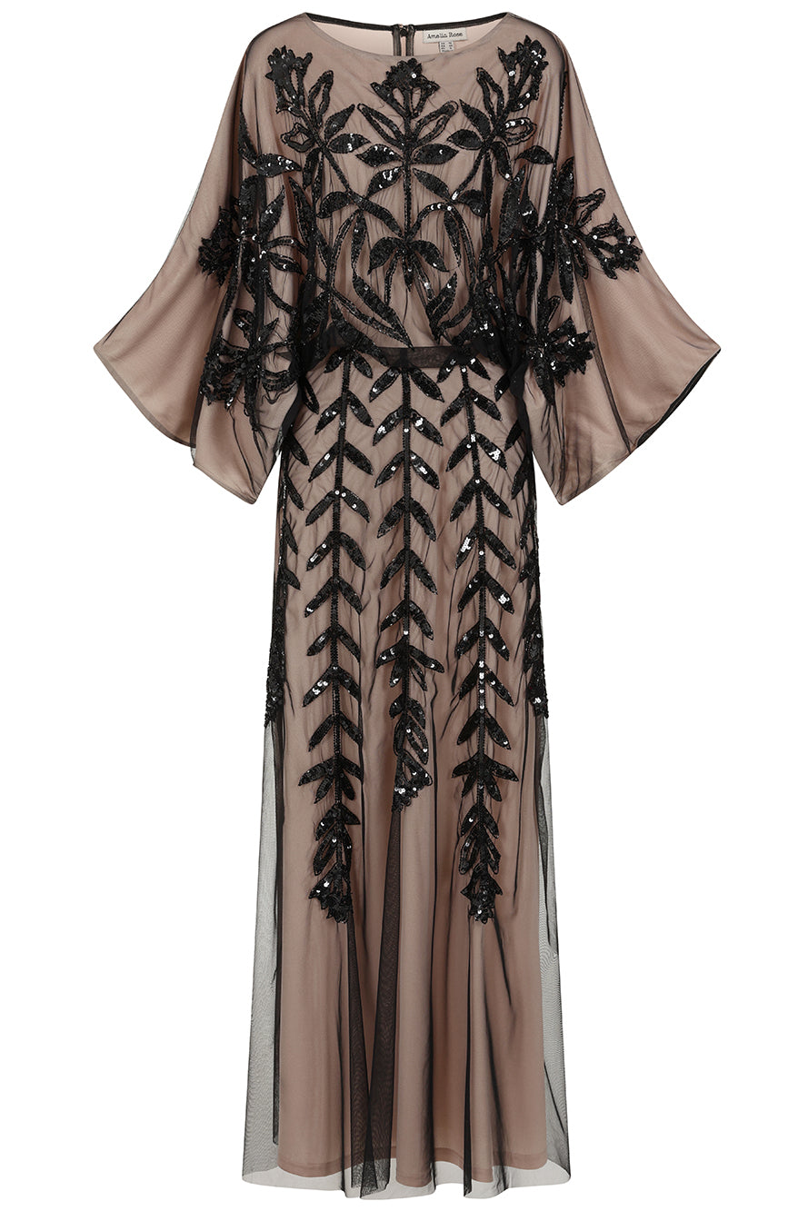 Elva sequin maxi dress with black leaf motif embellishment on a neutral base, batwing sleeves and flowing silhouette for statement occasion wear styling