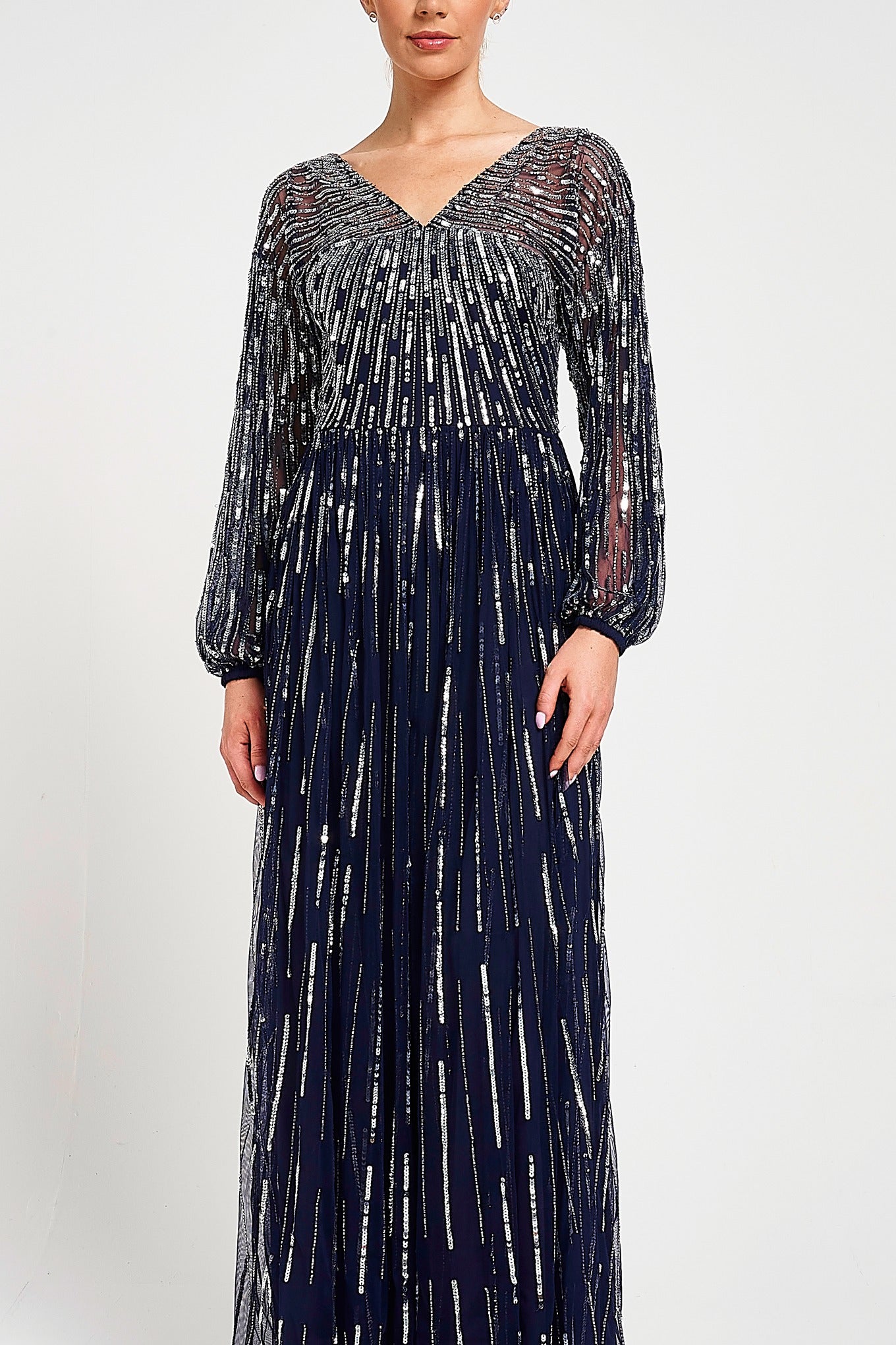 Elvina navy embellished maxi dress with cascading beadwork, V neckline and long sleeves designed for elegant wedding guest and occasion wear styling