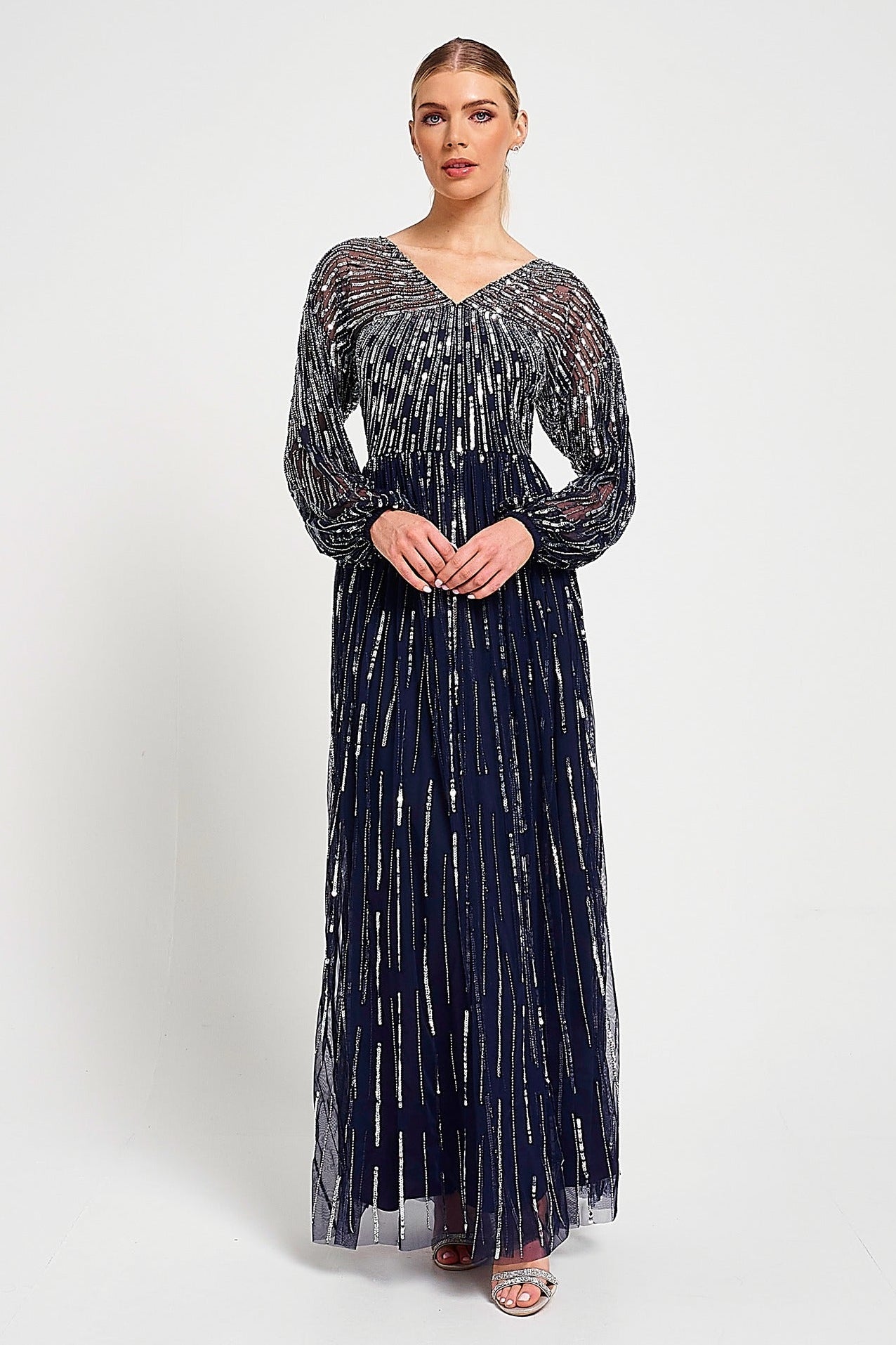 Elvina navy embellished maxi dress with cascading beadwork, V neckline and long sleeves designed for elegant wedding guest and occasion wear styling