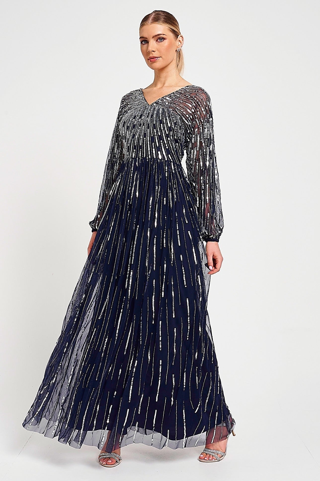 Elvina navy embellished maxi dress with cascading beadwork, V neckline and long sleeves designed for elegant wedding guest and occasion wear styling