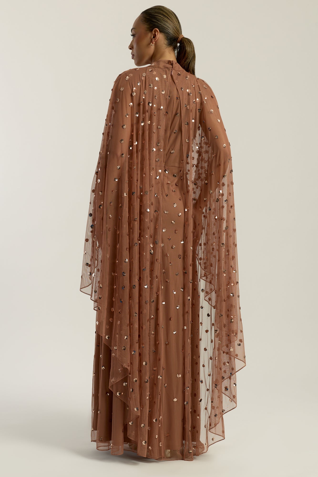 Elysia cape sleeve maxi dress with sequins and flowing silhouette for weddings and formal events.
