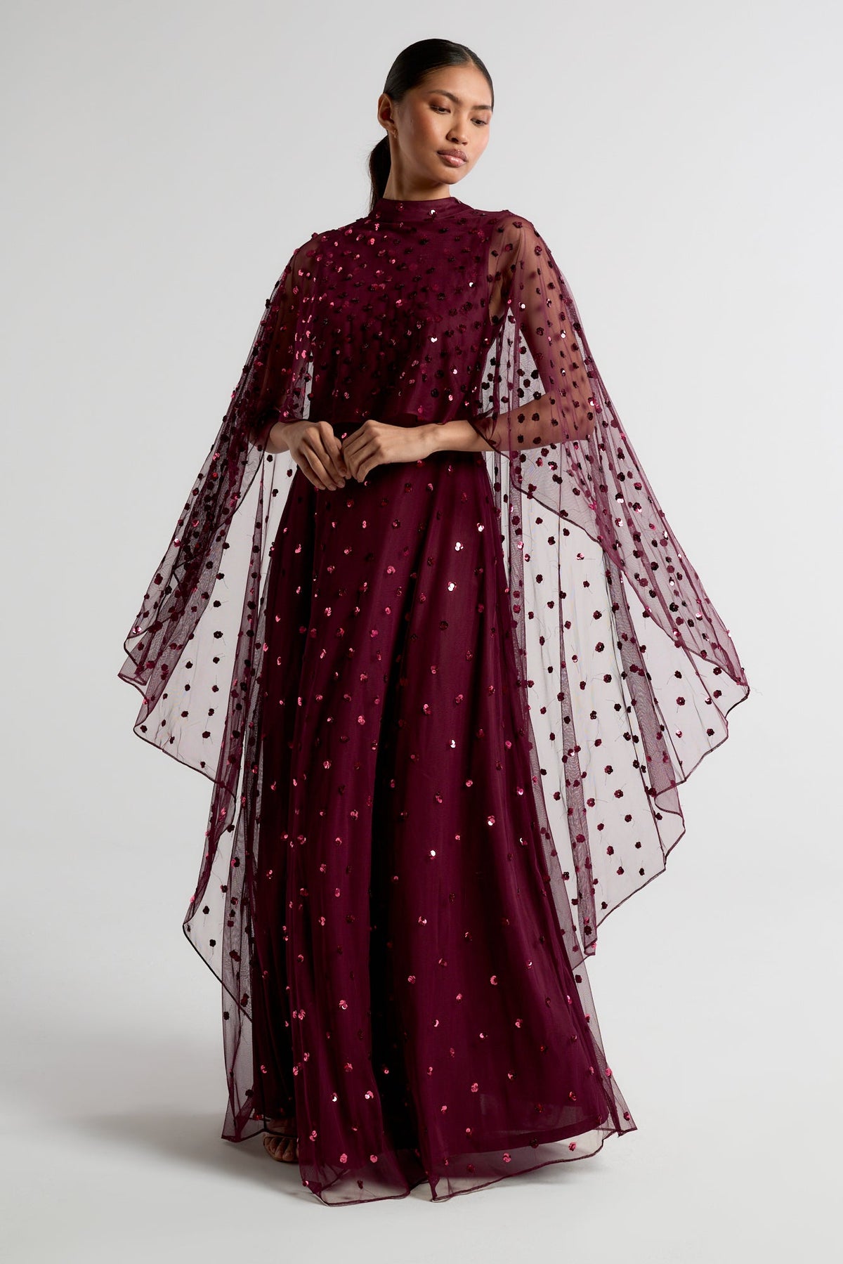 Elysia Purple Cape Dress with flowing floor-length silhouette, subtle sequin embellishments, and elegant cape overlay for weddings and evening occasions