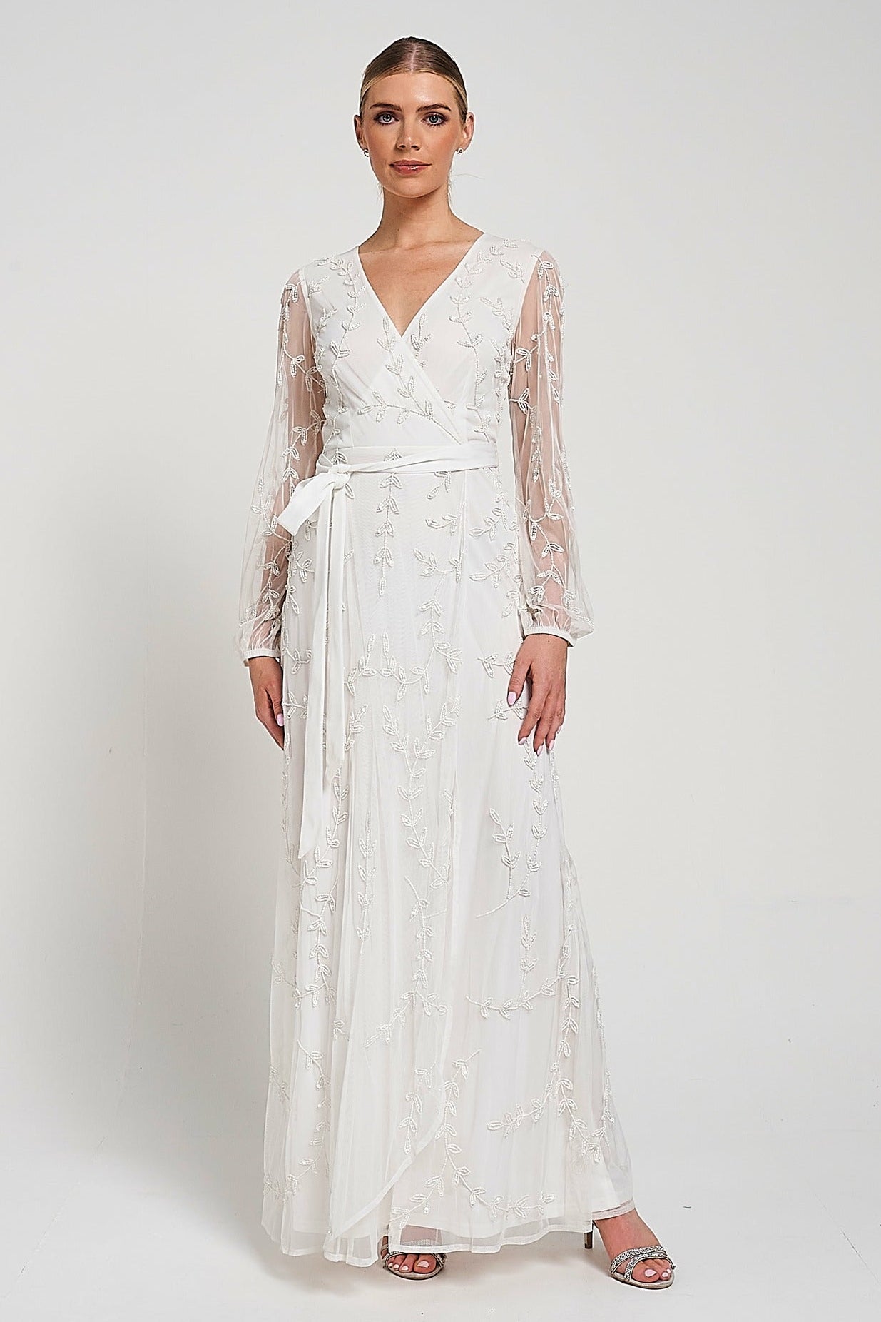 Grace white embellished maxi dress with tonal leaf detailing, faux wrap silhouette and long sleeves designed for elegant bridal and occasion wear styling